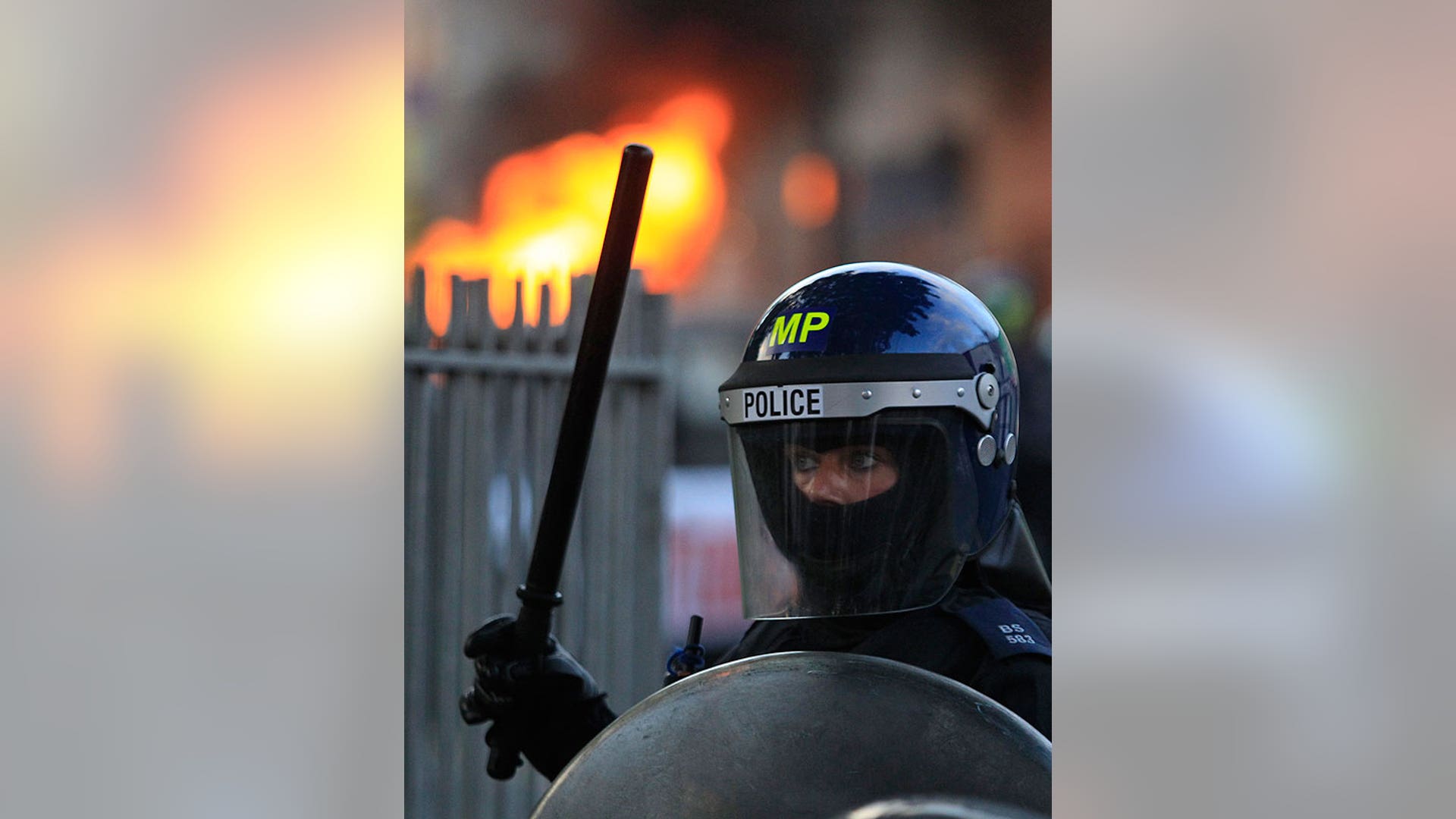 UK_riots_female_cop_AP
