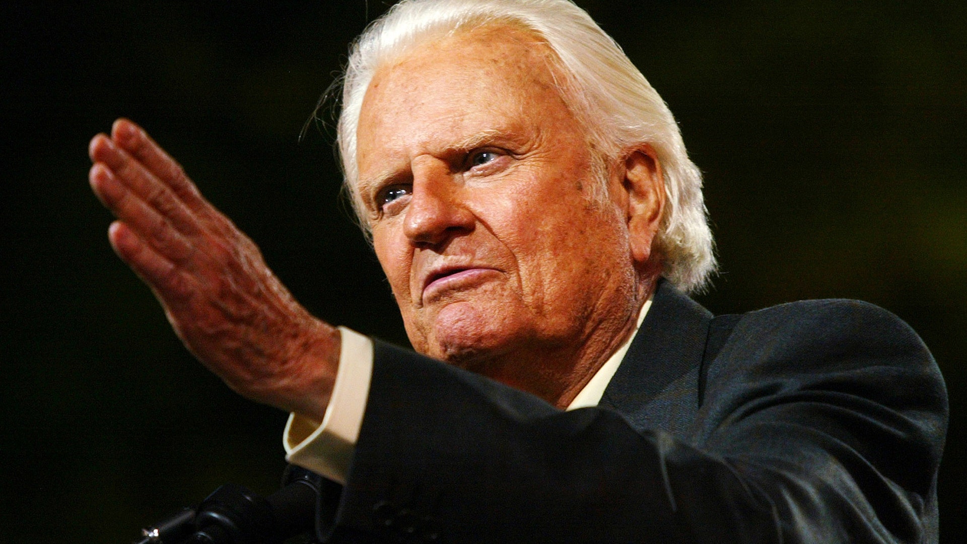 Evangelist Billy Graham speaks to thousands of people during his New York Crusade at Flushing Meadows Park in New York June 24, 2005