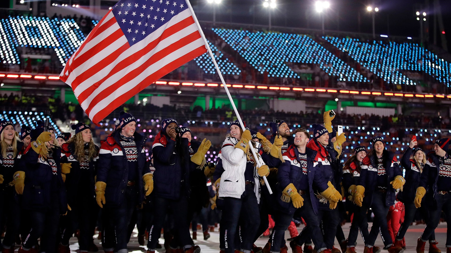 Erin Hamlin carries the flag of the United States during the opening ceremony of the 2018 Winter Olympics in Pyeongchang