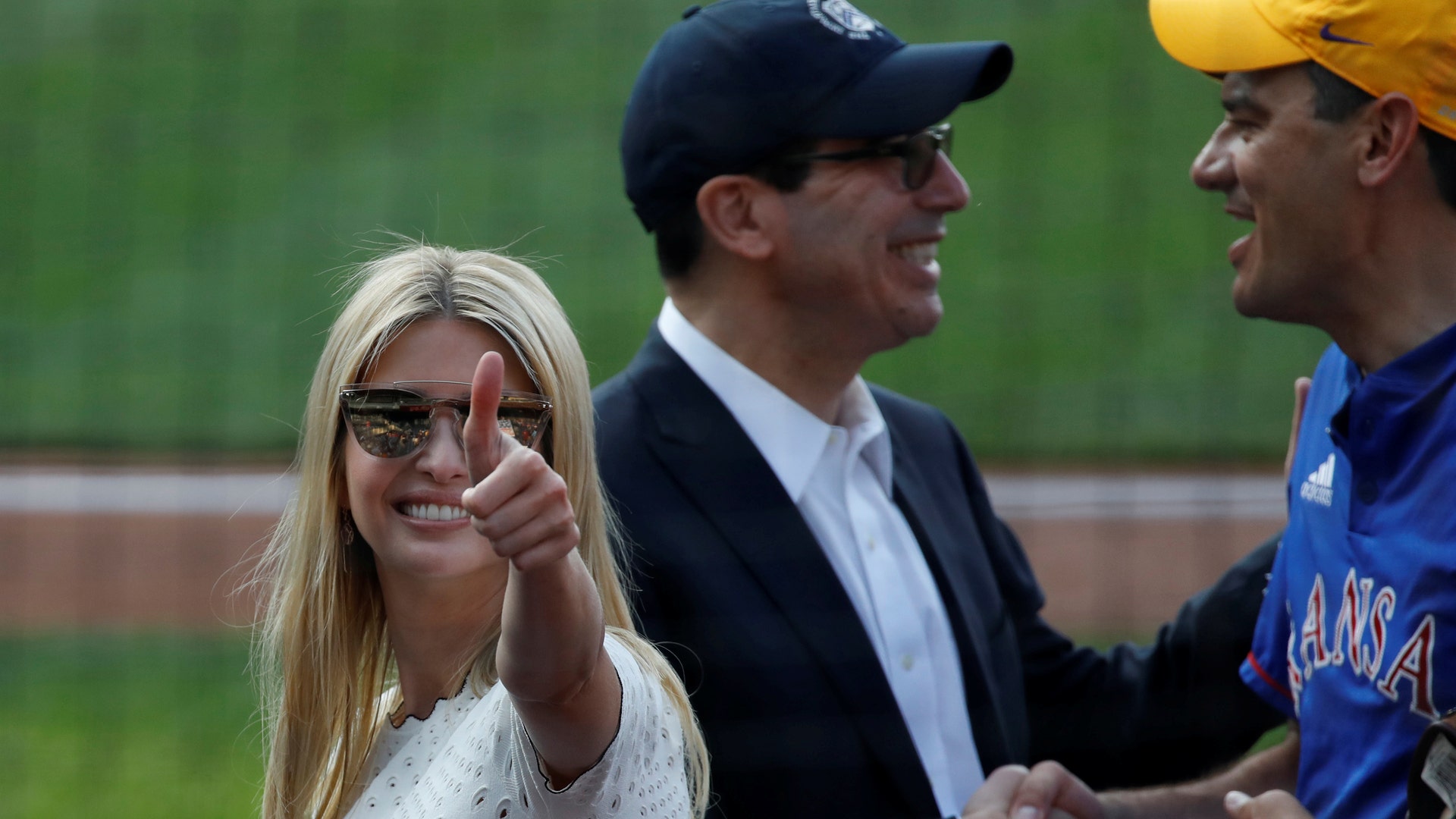 Ivanka Trump gestures to the crowd next to Treasury Secretary Steven Mnuchin prior to the Congressional baseball game