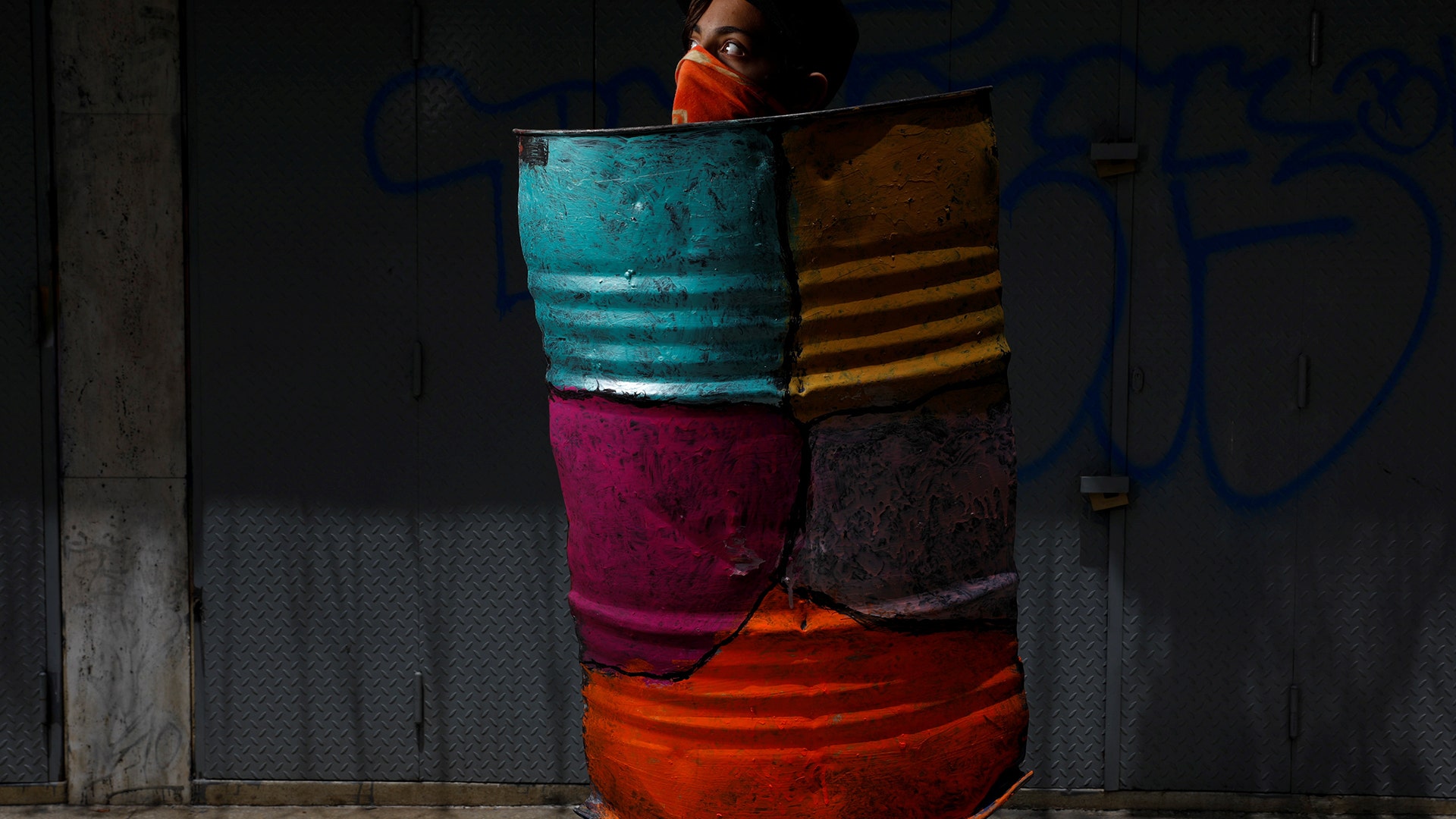 A demonstrator with a shield before a rally said: