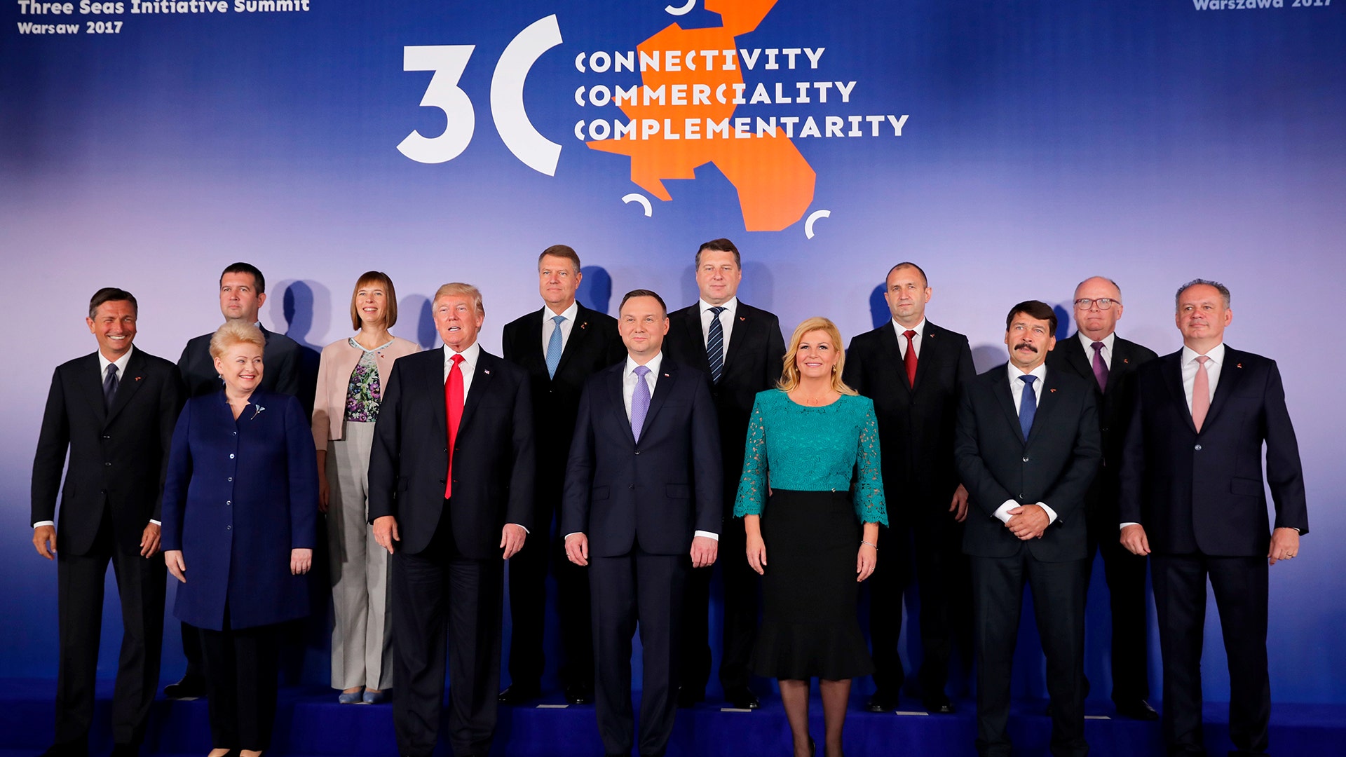 President Donald Trump and Polish President Andrzej Duda take part in a family photo at the Three Seas Initiative Summit in Warsaw