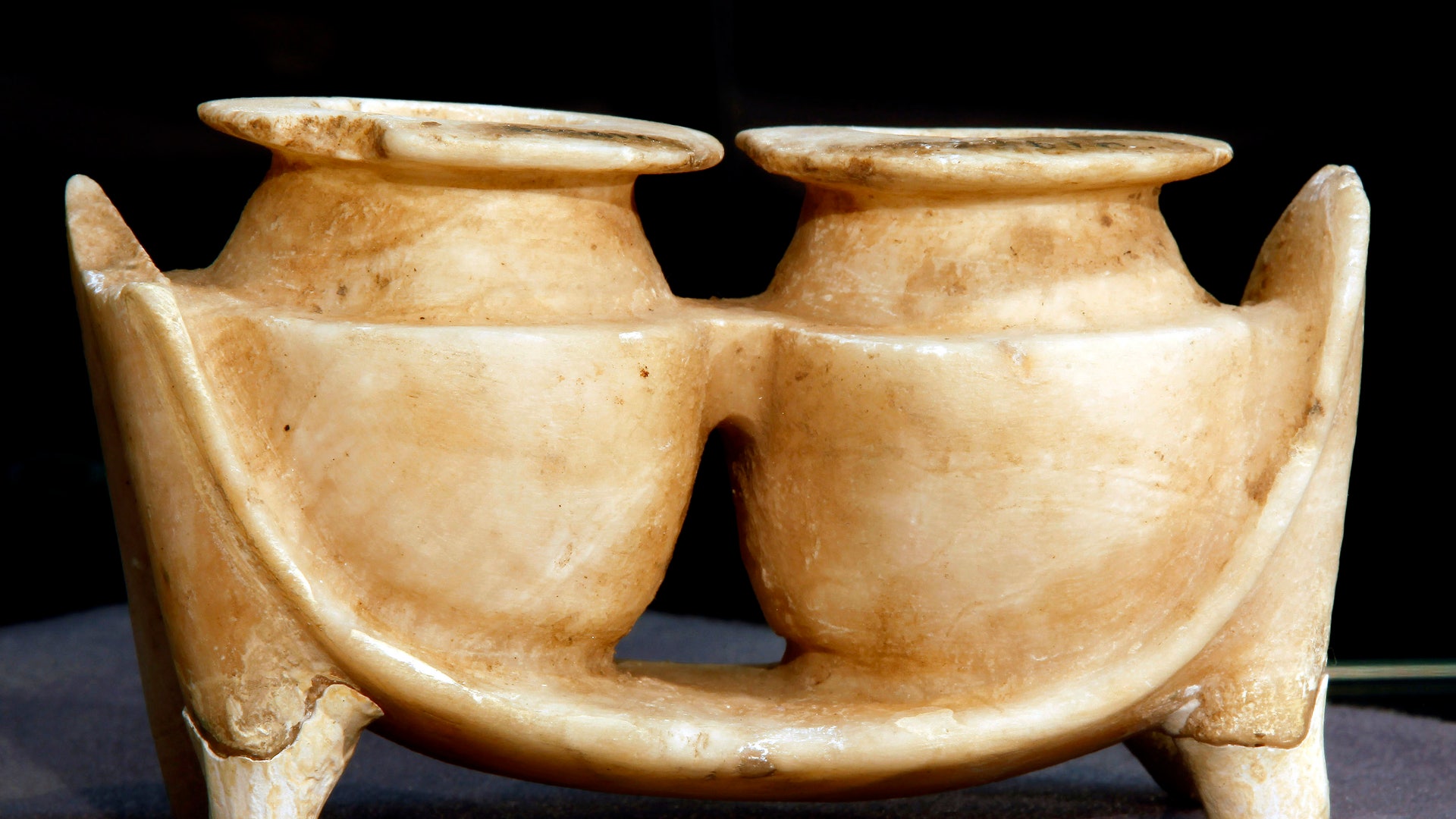 A cosmetic container carved from stone, found near Ur