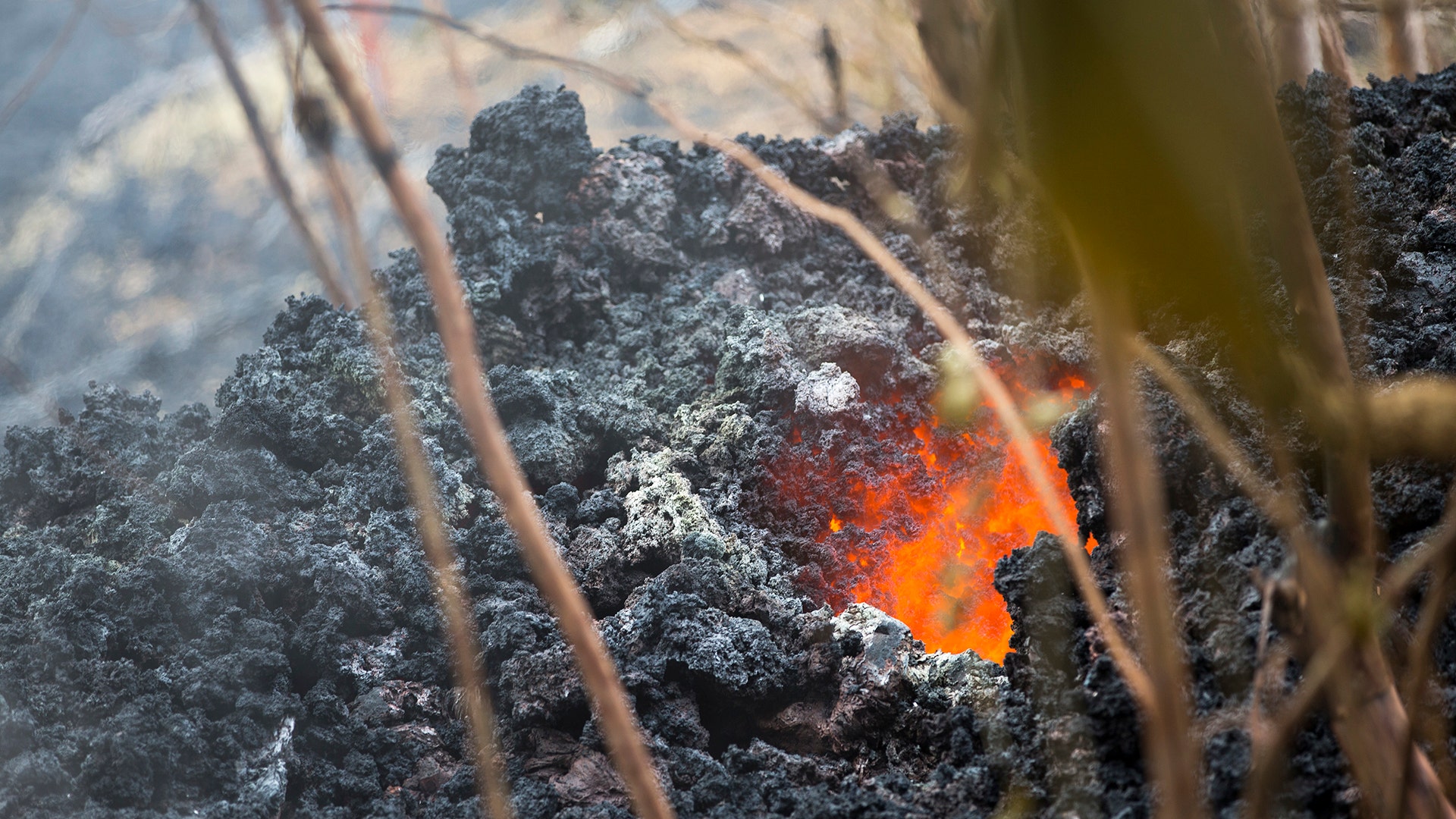 Lava glows from a vent on a lava bed at the Leilani Estates, in Pahoa, Hawaii, May 5, 2018