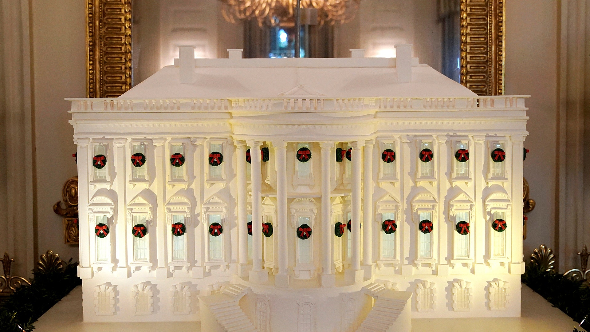 A gingerbread White House is seen on display in the State Dining Room of the White House.