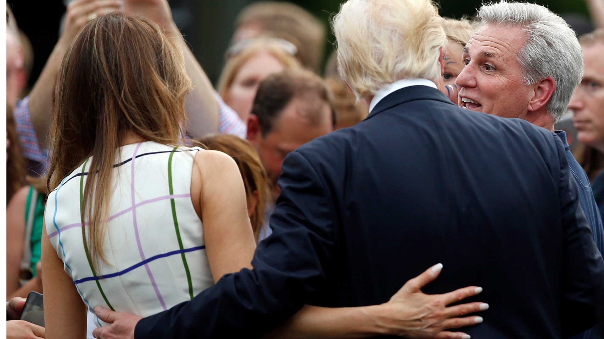 House Majority Leader Kevin McCarthy of Calif., talks with President Donald Trump with first lady Melania Trump during the Congressional Picnic