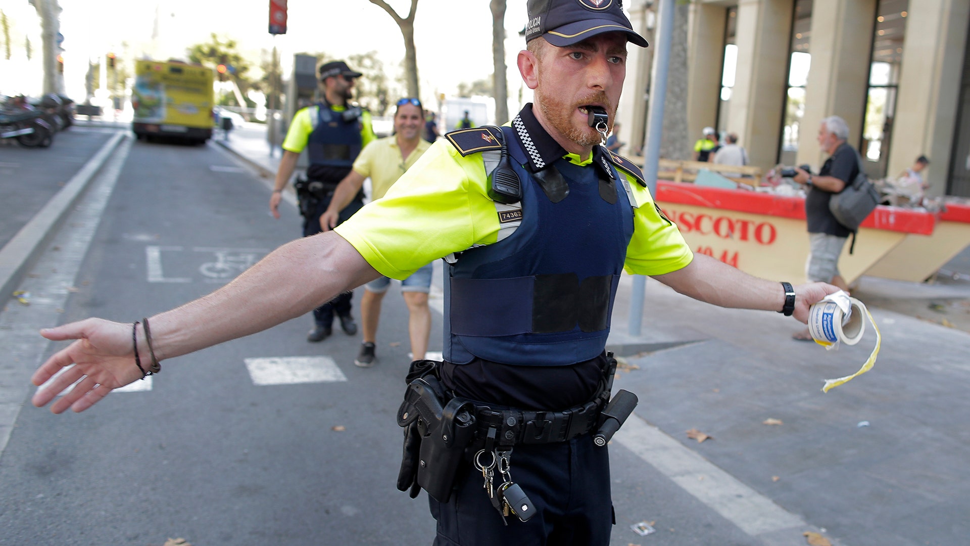 A police officer after a van crashed into a crowd of residents and tourists on Las Ramblas in Barcelona, August 17
