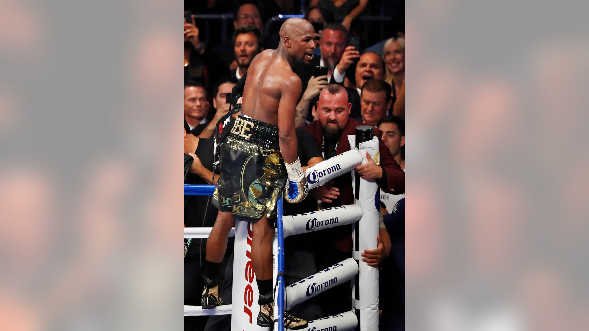 Floyd Mayweather Jr. celebrates after defeating Conor McGregor in a super welterweight boxing match Saturday in Las Vegas
