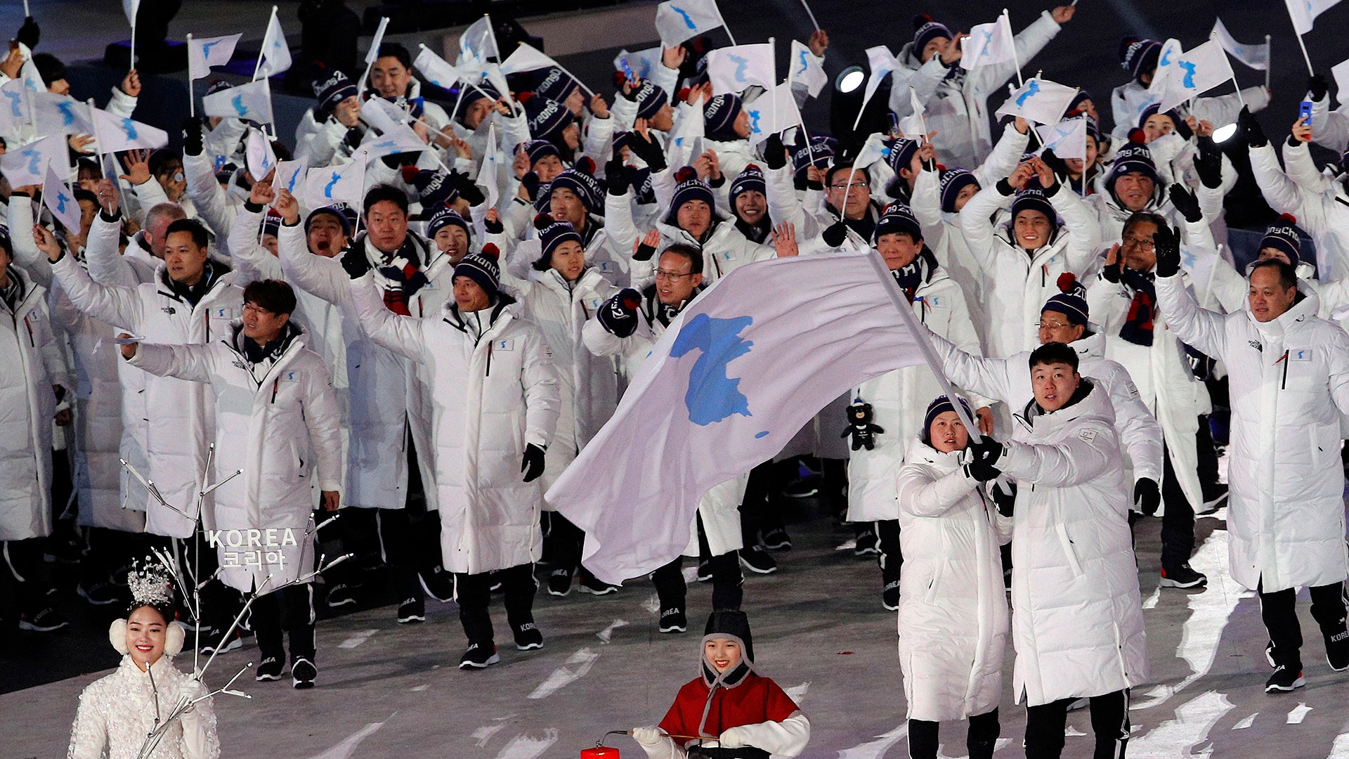 North Korea's Hwang Chung Gum and South Korea's Won Yun-jong march during the opening ceremony of the 2018 Winter Olympics