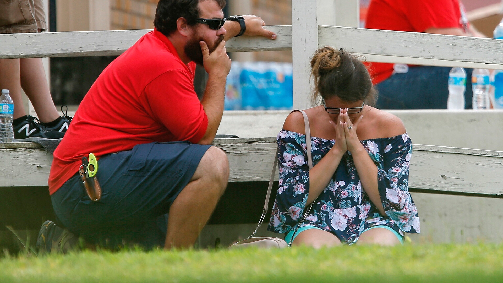 A woman prays following a shooting at Santa Fe High School, in Santa Fe, Texas, May 18, 2018