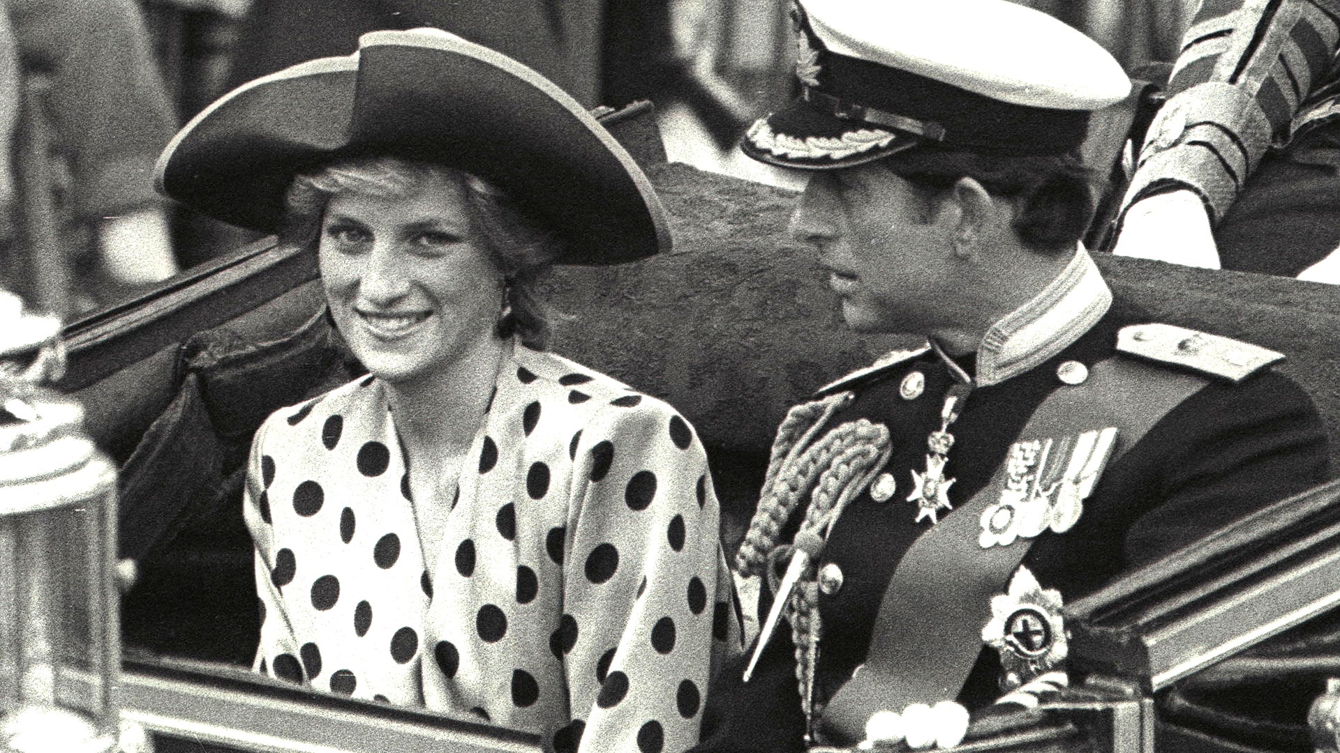 Prince Charles and Princess Diana ride in an open carriage from Buckingham Palace to Westminster Abbey on July 23, 1986