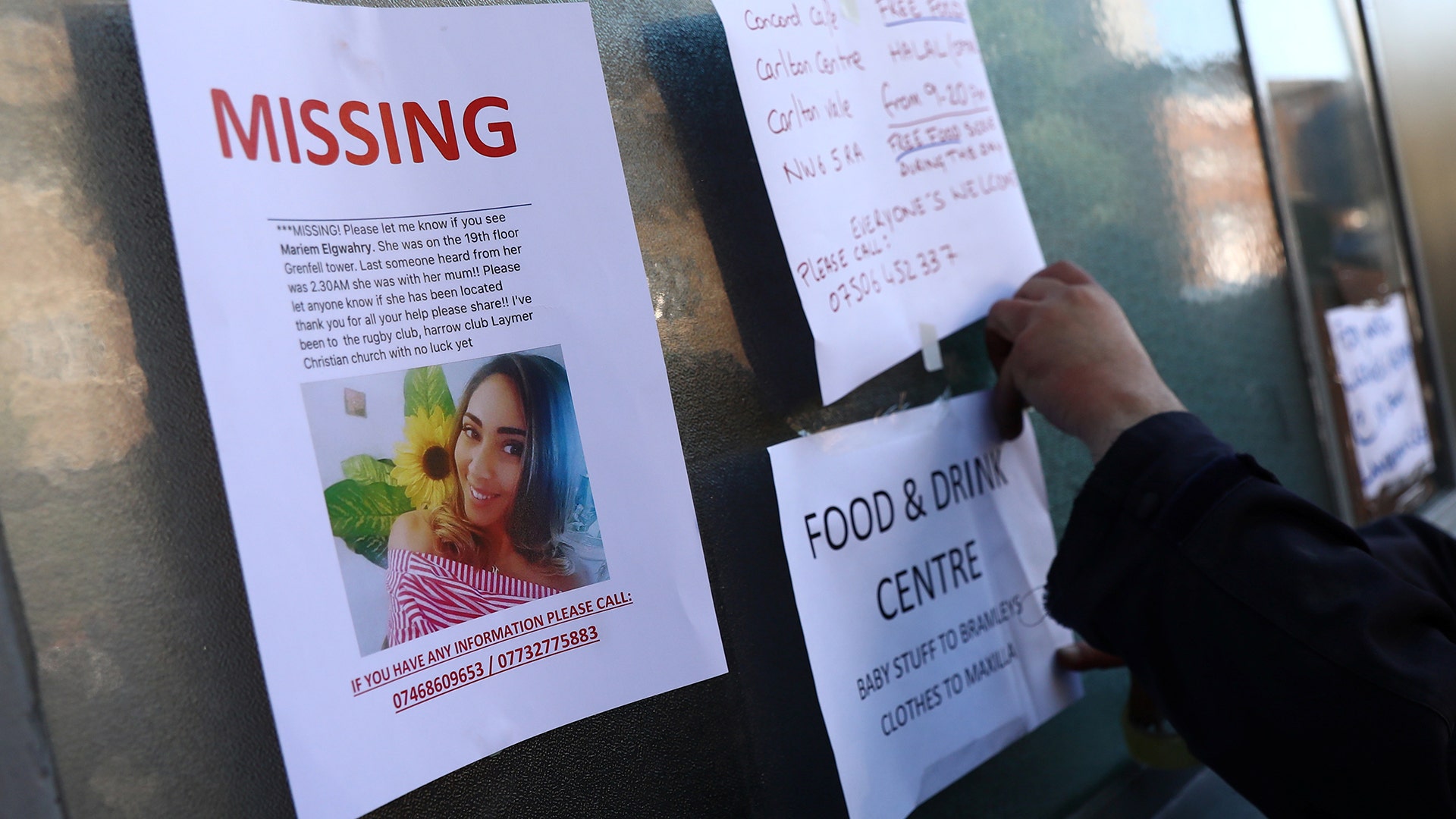 Messages are displayed near the apartment building destroyed in a fire in north Kensington, West London