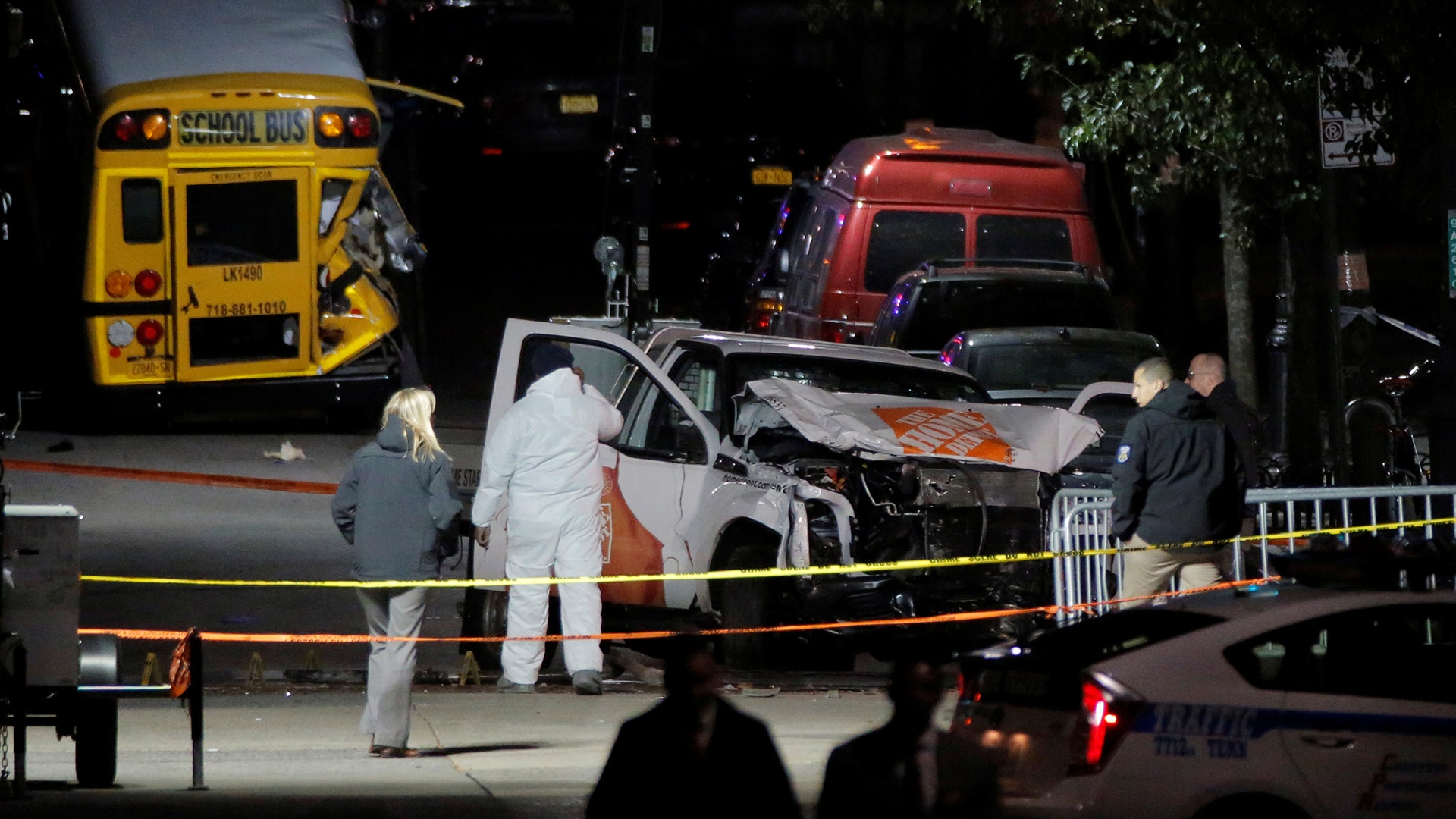 Police investigate a pickup truck that was used in an attack in New York City, November 1