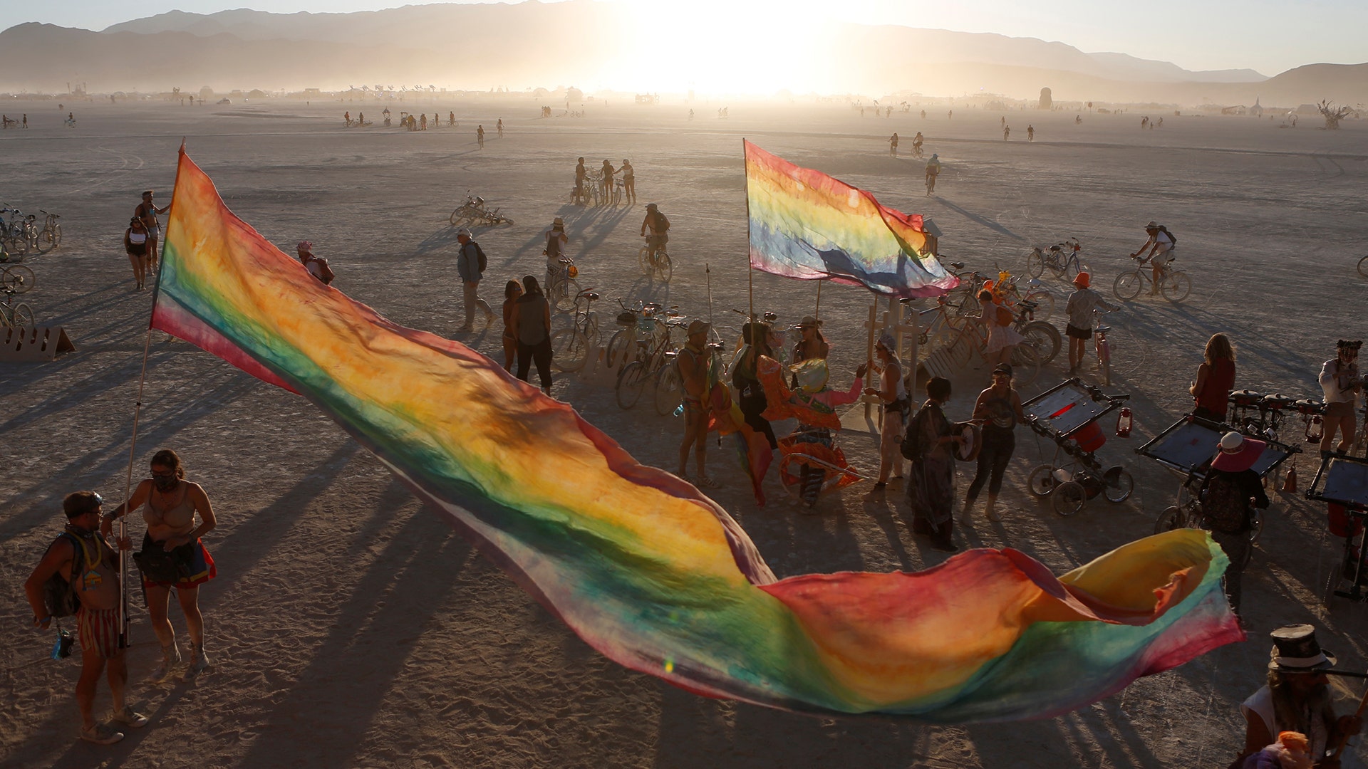 The sun sets on the playa at the annual Burning Man arts and music festival in the Black Rock Desert of Nevada, August 28