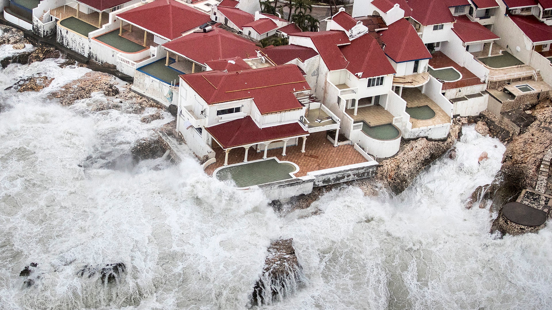 Waves crash into homes caused by Hurricane Irma in St. Maarten, Wednesday
