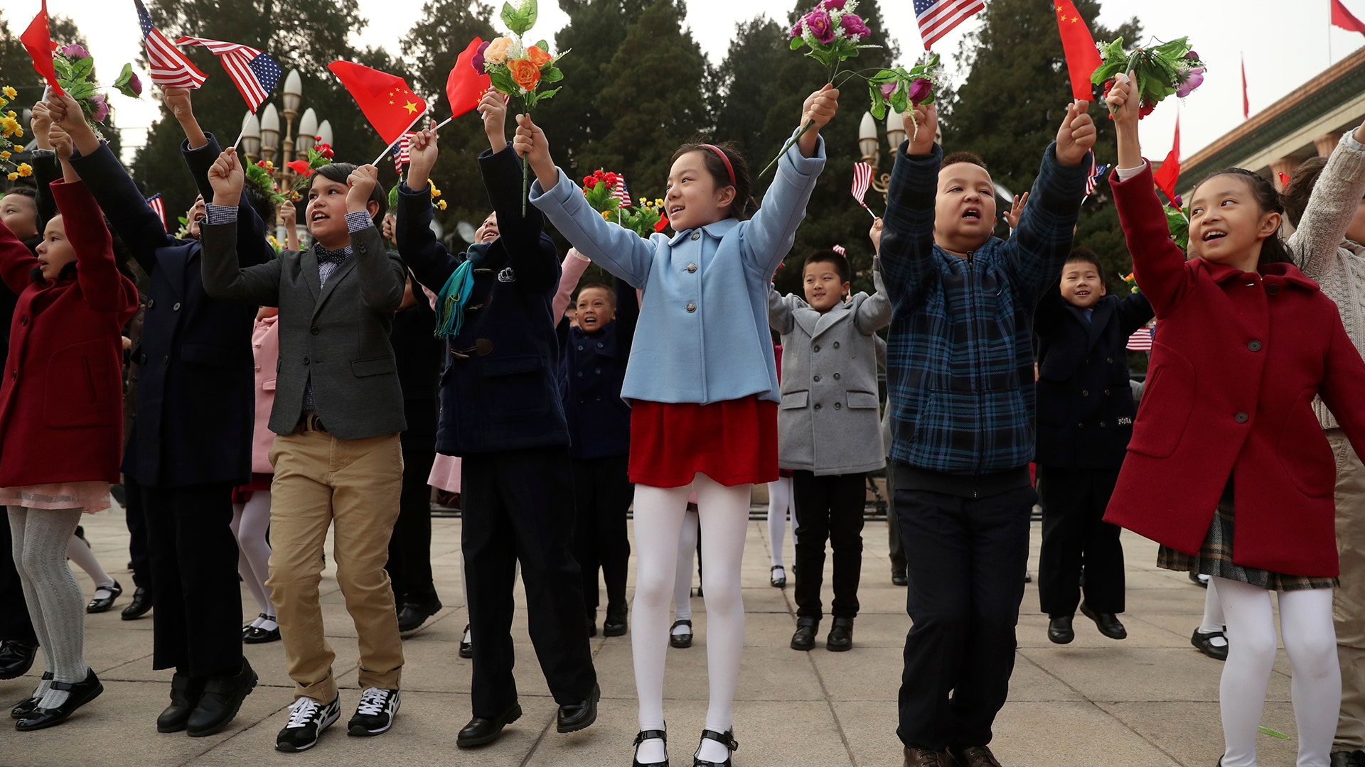 Children participate in a welcoming ceremony for President Donald Trump at the Great Hall of the People, in Beijing, China, Thursday