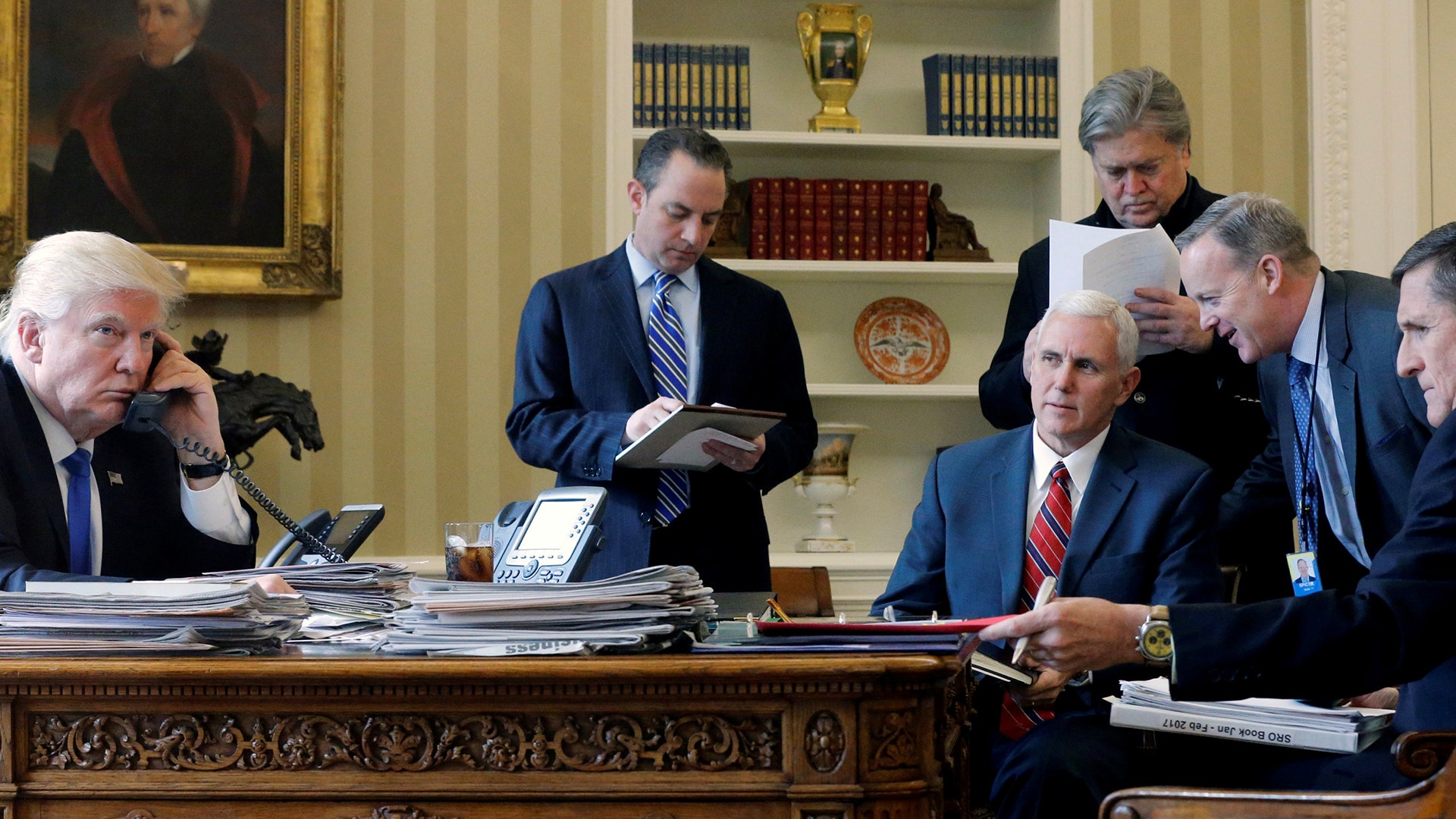 President Donald Trump is joined by Reince Priebus, Vice President Mike Pence, Steve Bannon, Sean Spicer and Mike Flynn in the Oval Office