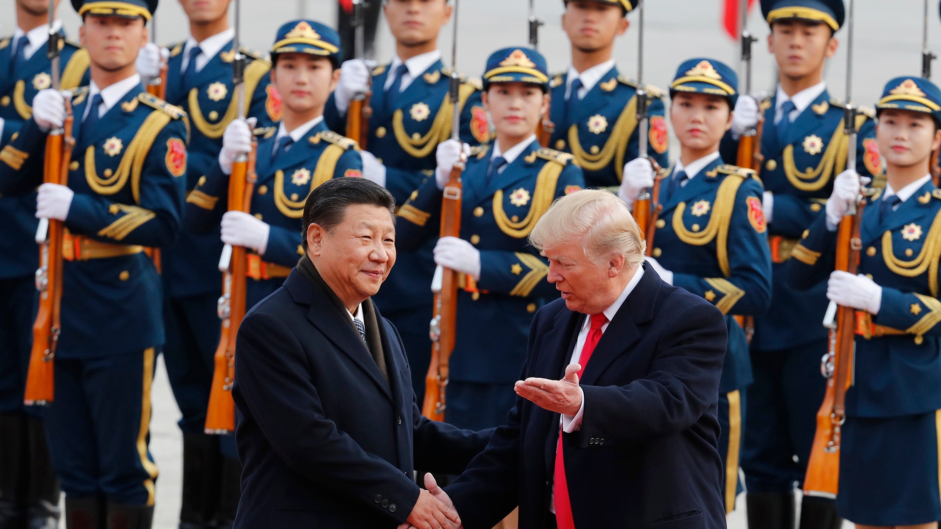 President Donald Trump shakes hands with Chinese President Xi Jinping at a welcoming ceremony in Beijing, Thursday