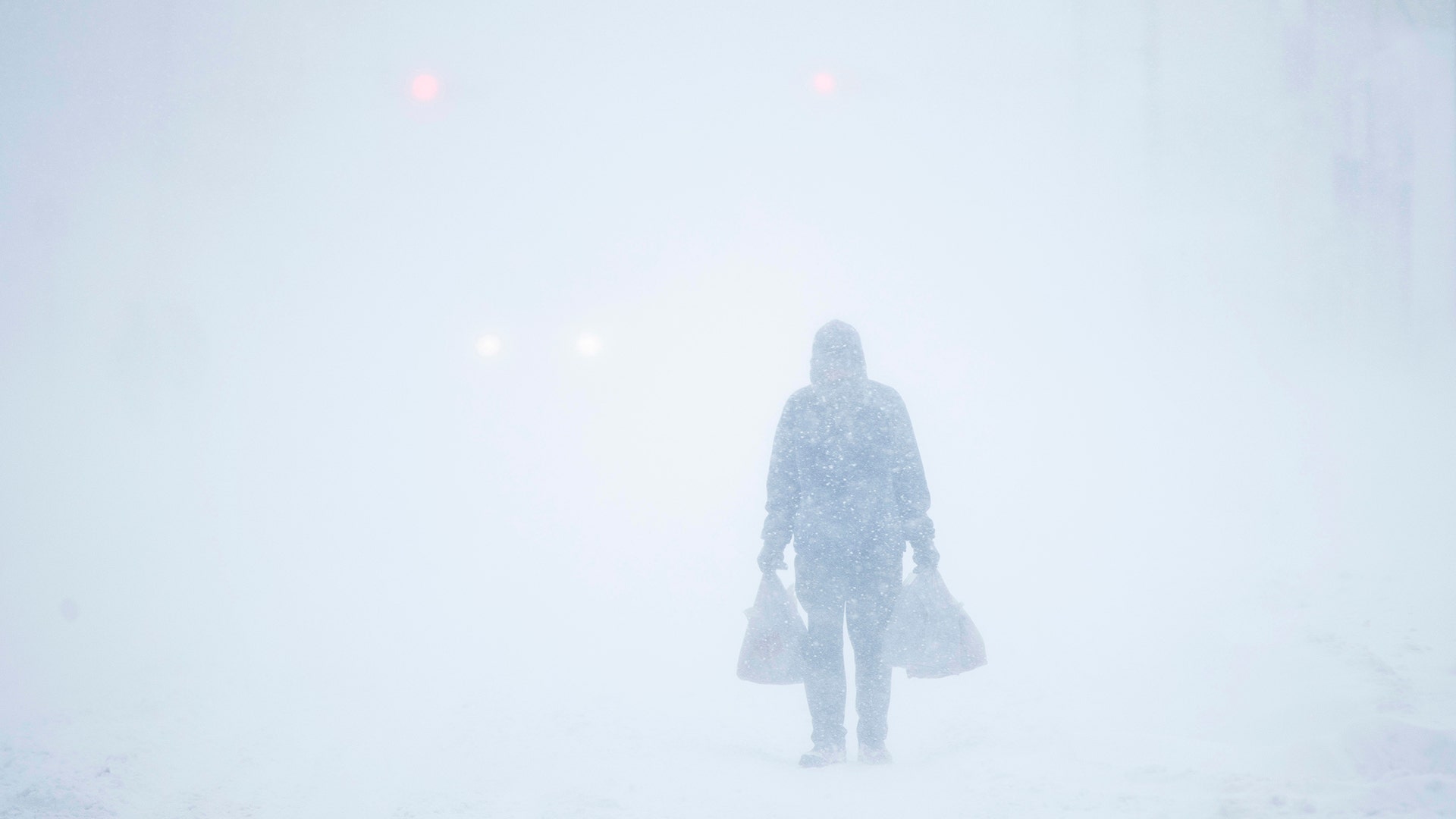 A man makes his way through the snowfall in Atlantic City, N.J., January 4, 2018
