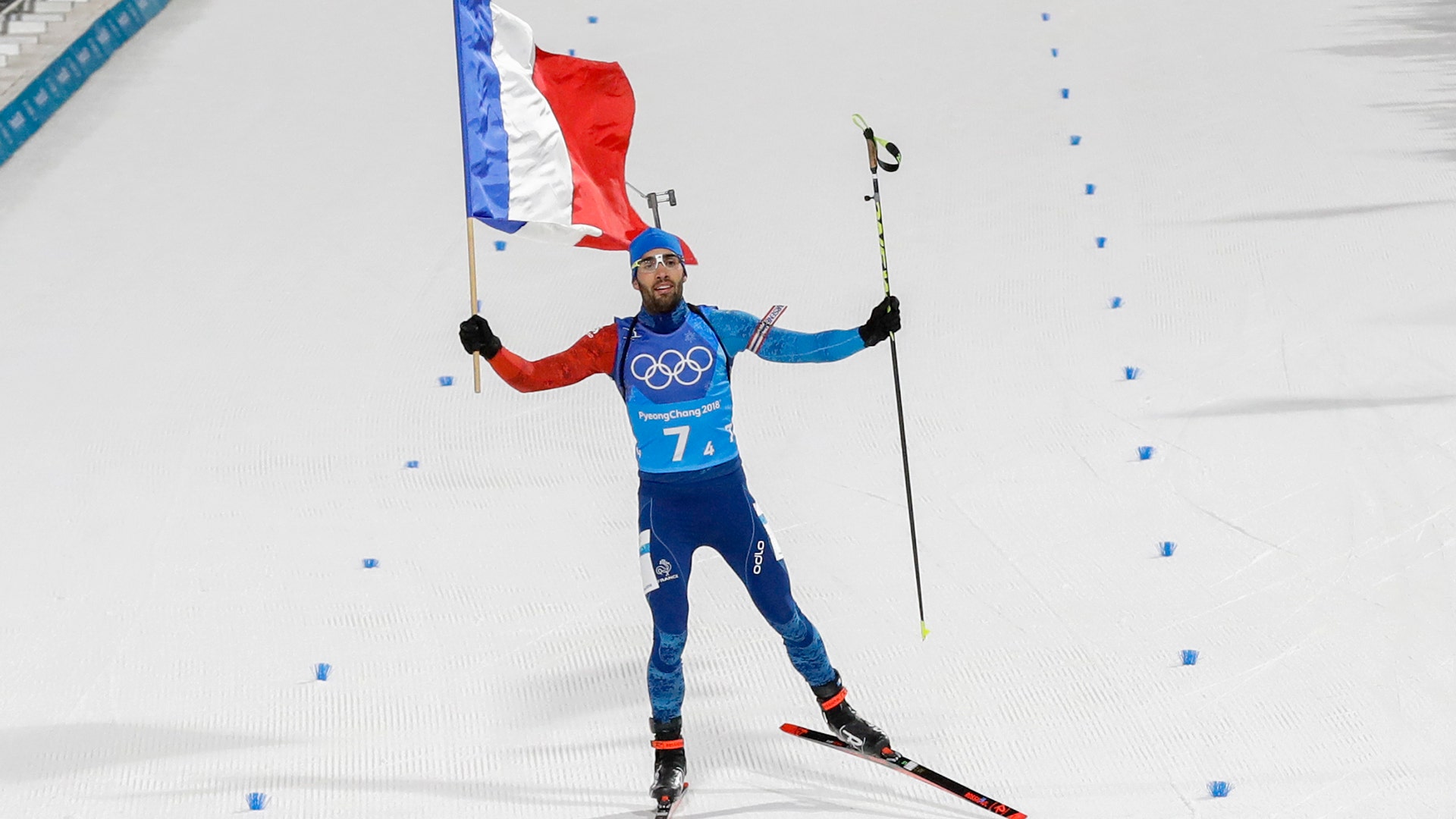 Martin Fourcade, of France winning the gold medal for Team France in the mixed relay biathlon at the 2018 Winter Olympics
