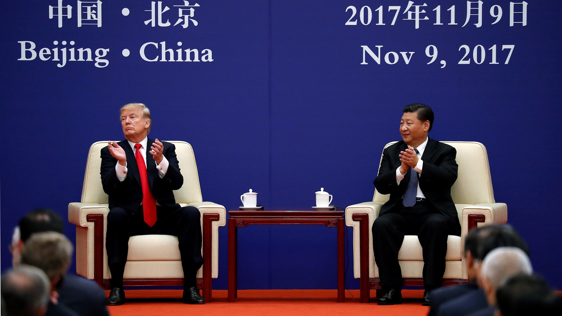 President Donald Trump and China's President Xi Jinping meet business leaders at the Great Hall of the People in Beijing, China, Thursday