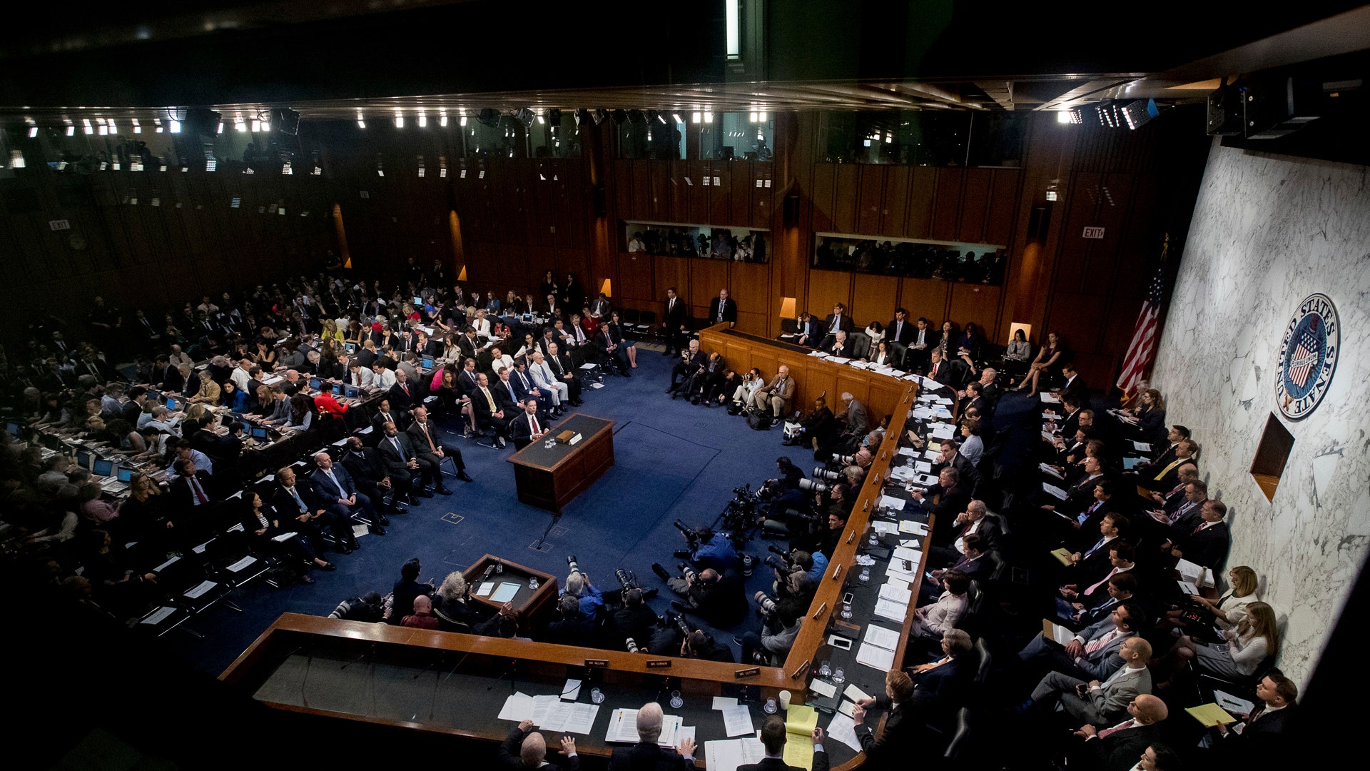 Former FBI Director James Comey speaks during a Senate Intelligence Committee hearing on Capitol Hill