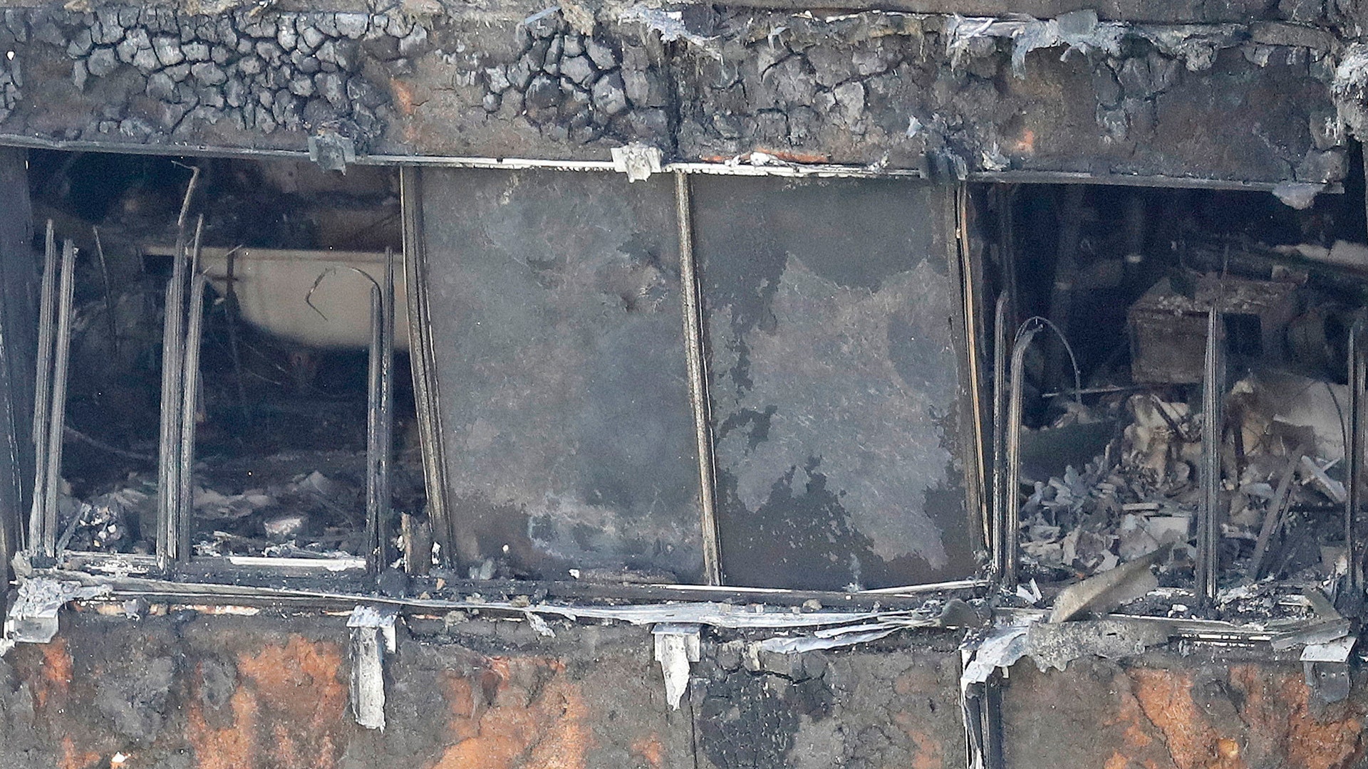 Part of the scorched facade of the Grenfell Tower in London, Thursday