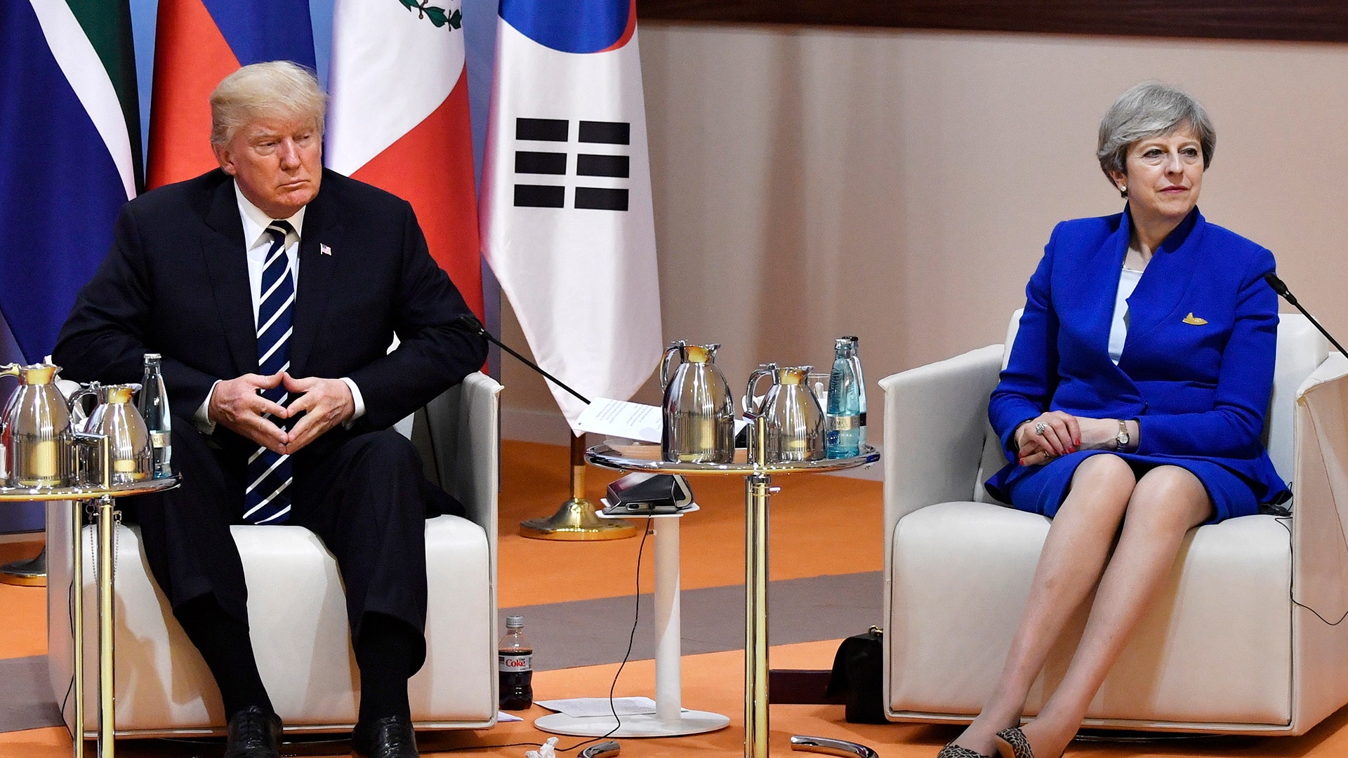 President Donald Trump and Britain's Prime Minister Theresa May attend the 