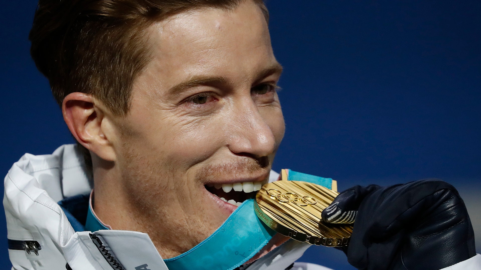 Gold medalist Shaun White of the United States during the victory ceremony for men's halfpipe at the 2018 Winter Olympics