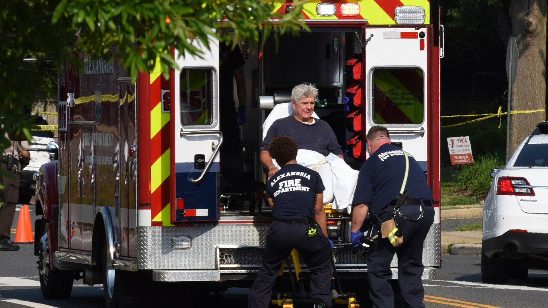 Rep. Roger Williams, R-Texas is placed into an ambulance at the scene of a shooting at a baseball field in Alexandria, Va