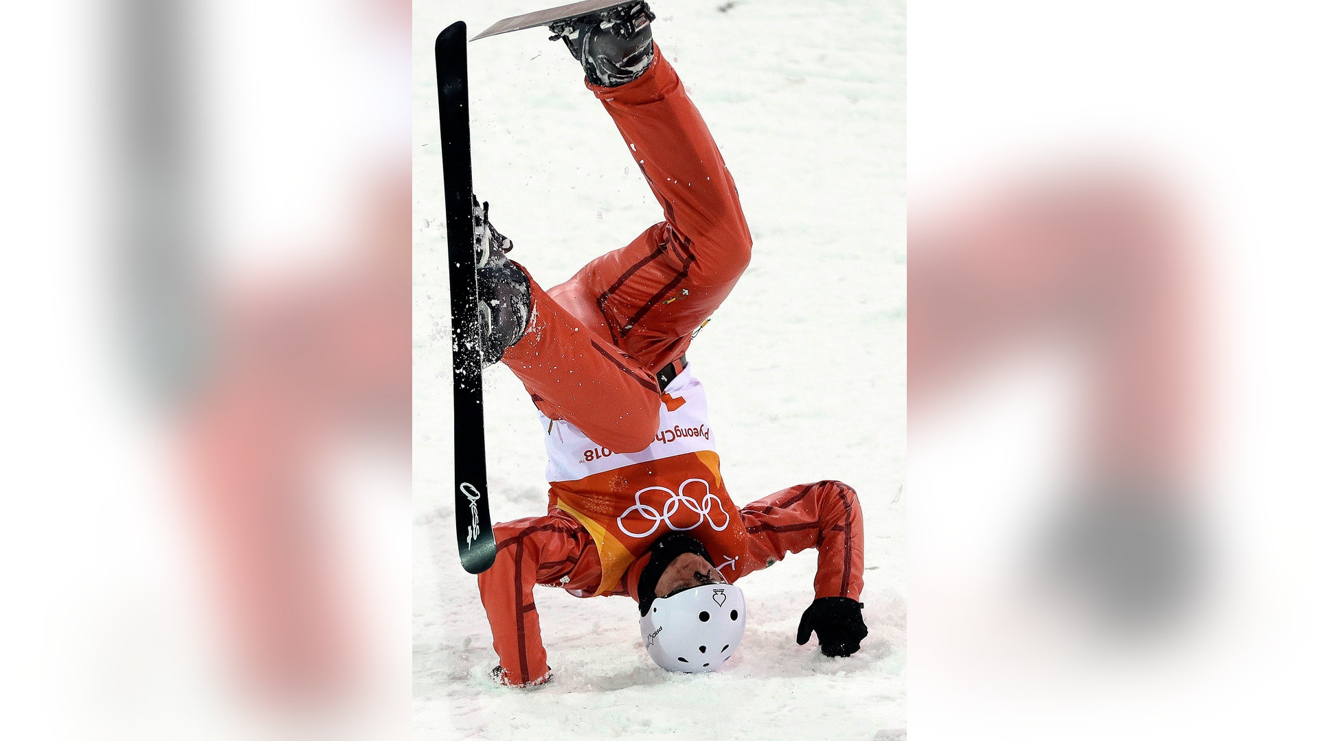 Stanislau Hladchenko of Belarus, crashes during the men's aerial final at the 2018 Winter Olympics in Pyeongchang