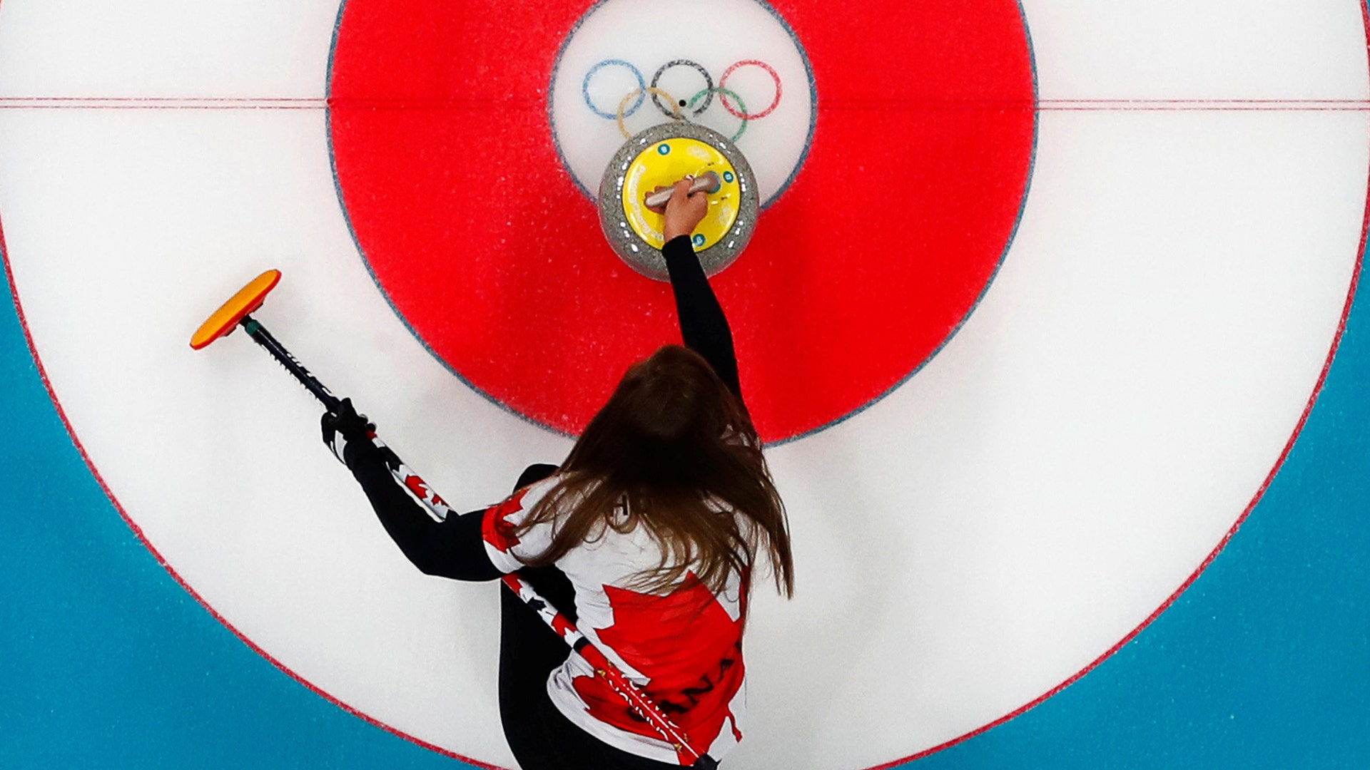  Skip Rachel Homan of Canada delivers a stone during a curling match against Japan at the 2018 Winter Olympics