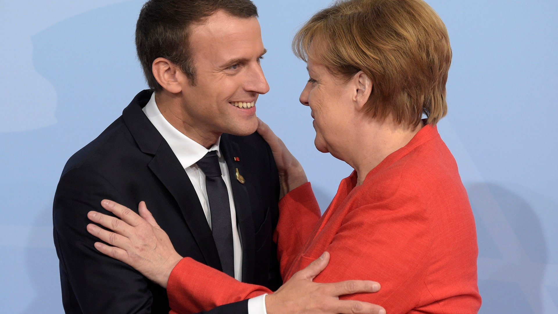German Chancellor Angela Merkel welcomes France's President Emmanuel Macron at the G-20 summit in Hamburg, Germany