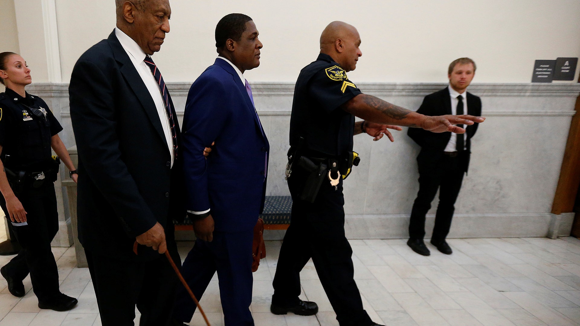 Bill Cosby leaves the courtroom as the jury deliberates during his trial for sexual assault case on June 12, 2017. 