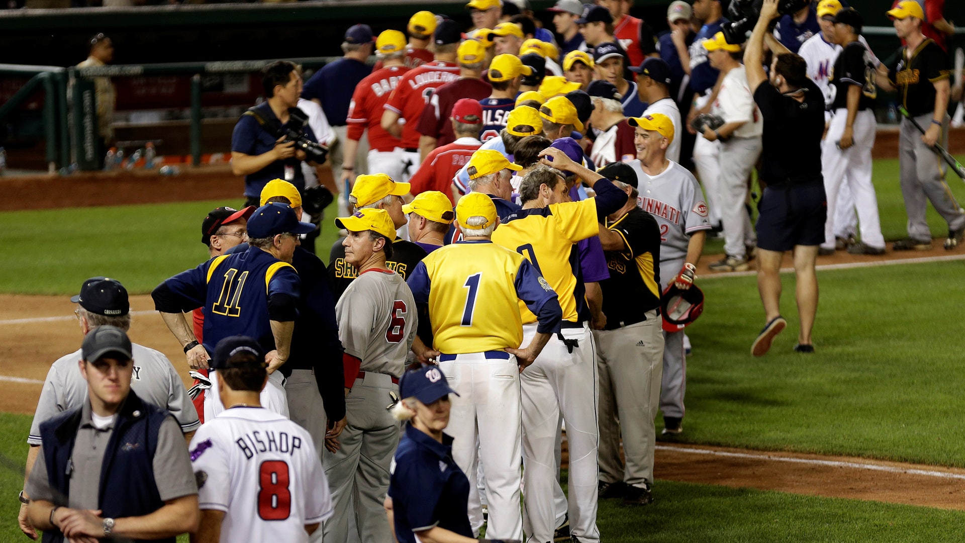 Democrats and Republicans greet each other after the annual Congressional baseball 