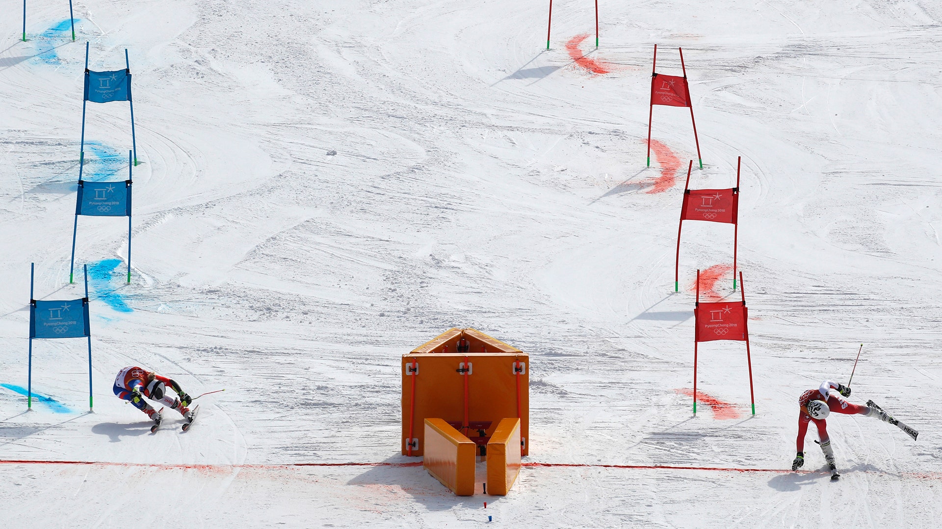 Tessa Worley of France and Wendy Holdener of Switzerland compete in the Team Event