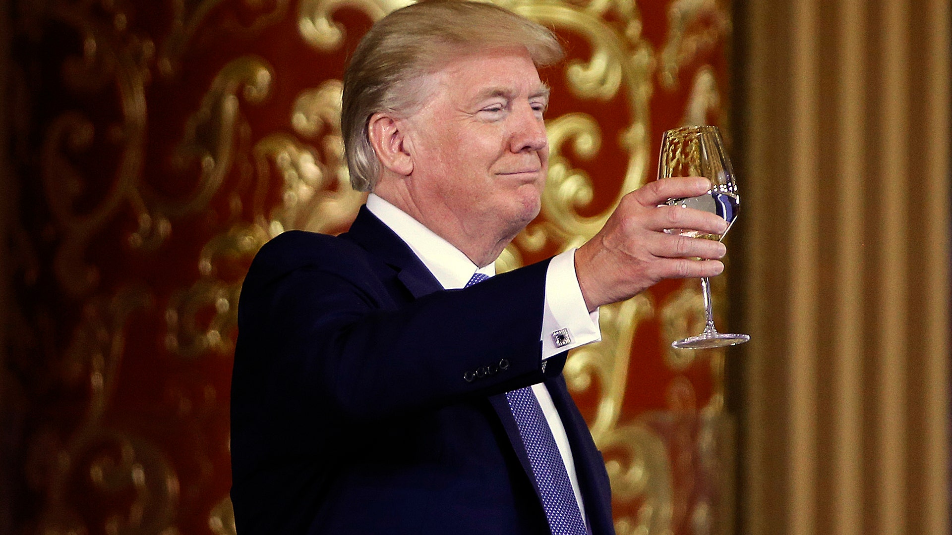 President Donald Trump toasts at a state dinner at the Great Hall of the People in Beijing, China, Thursday