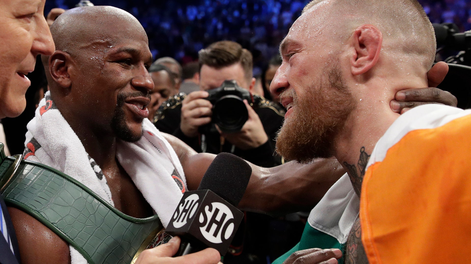 Floyd Mayweather Jr., with Conor McGregor after their super welterweight boxing match Saturday in Las Vegas