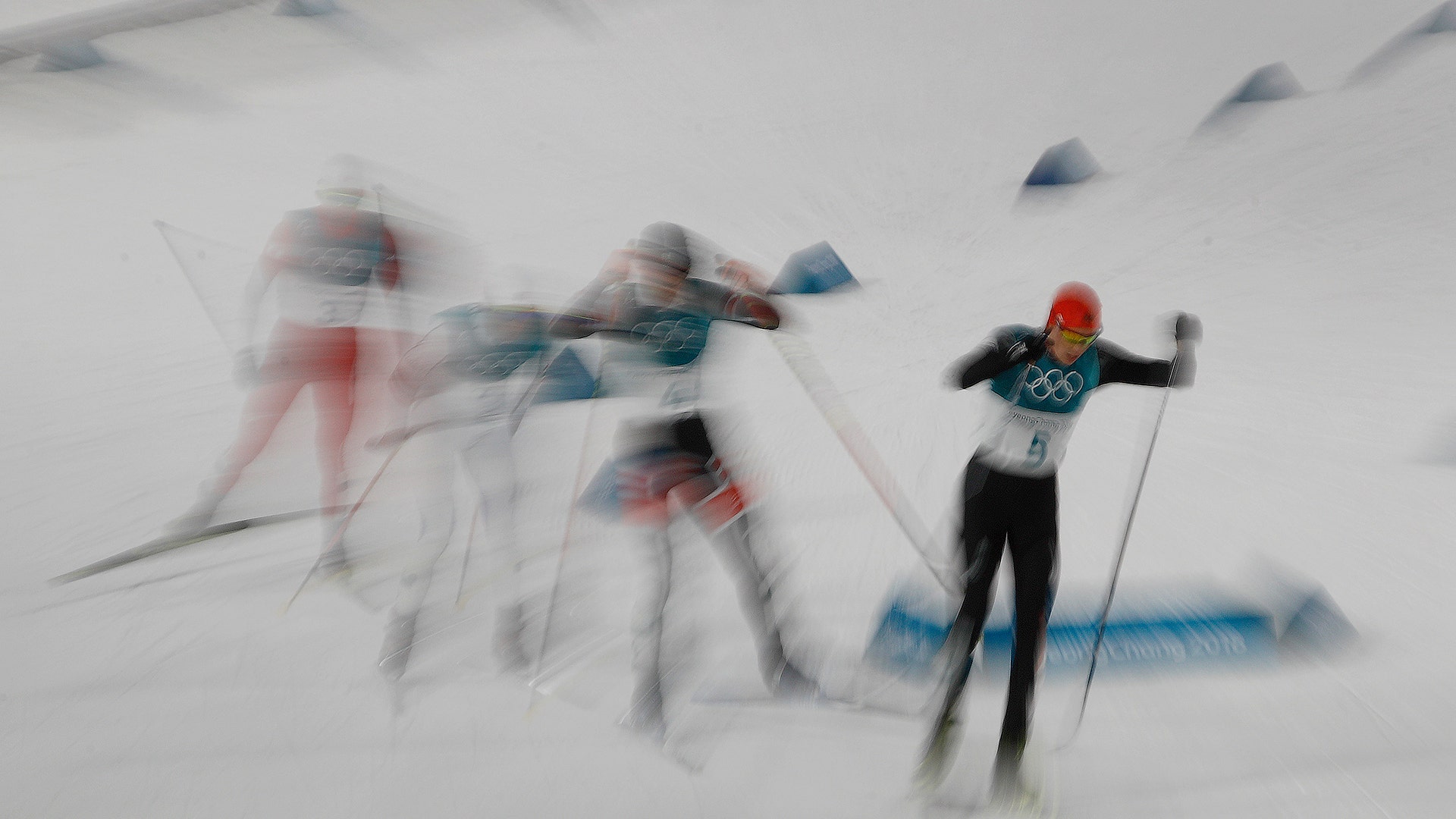 Gold medalist Eric Frenzel of Germany, leads the pack in the 10km cross-country skiing portion of the nordic combined at the Winter Olympics