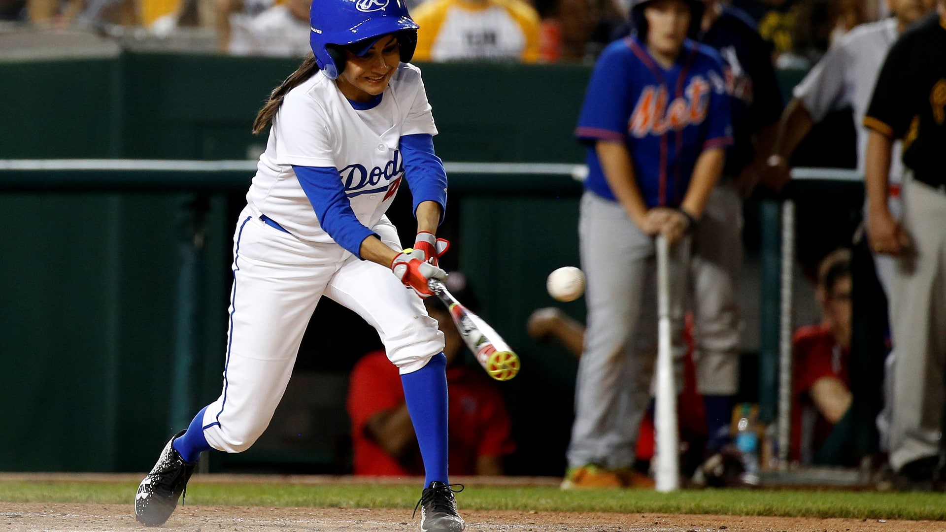 Rep. Nanette Barragan (D-CA) hits the ball for a single in the annual Congressional baseball game