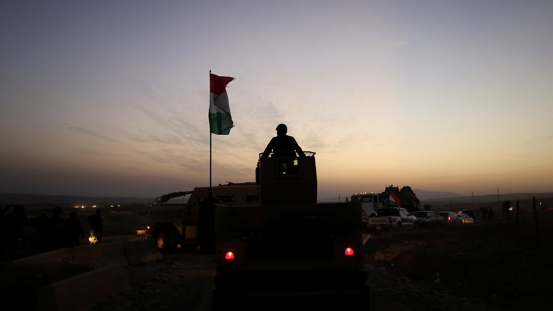 A Kurdish Peshmerga fighter in front of an Islamic State militants' position outside the town of Naweran near Mosul, Iraq October 20, 2016