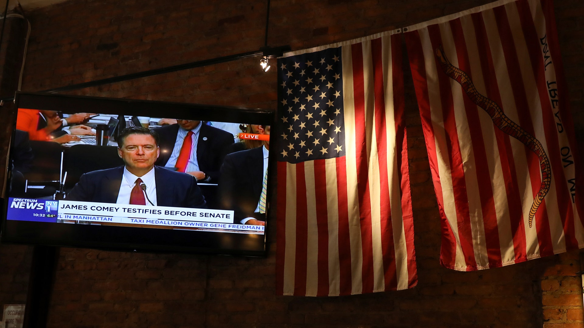 A TV shows former FBI director James Comey's testimony before the Senate Intelligence Committee in New York City