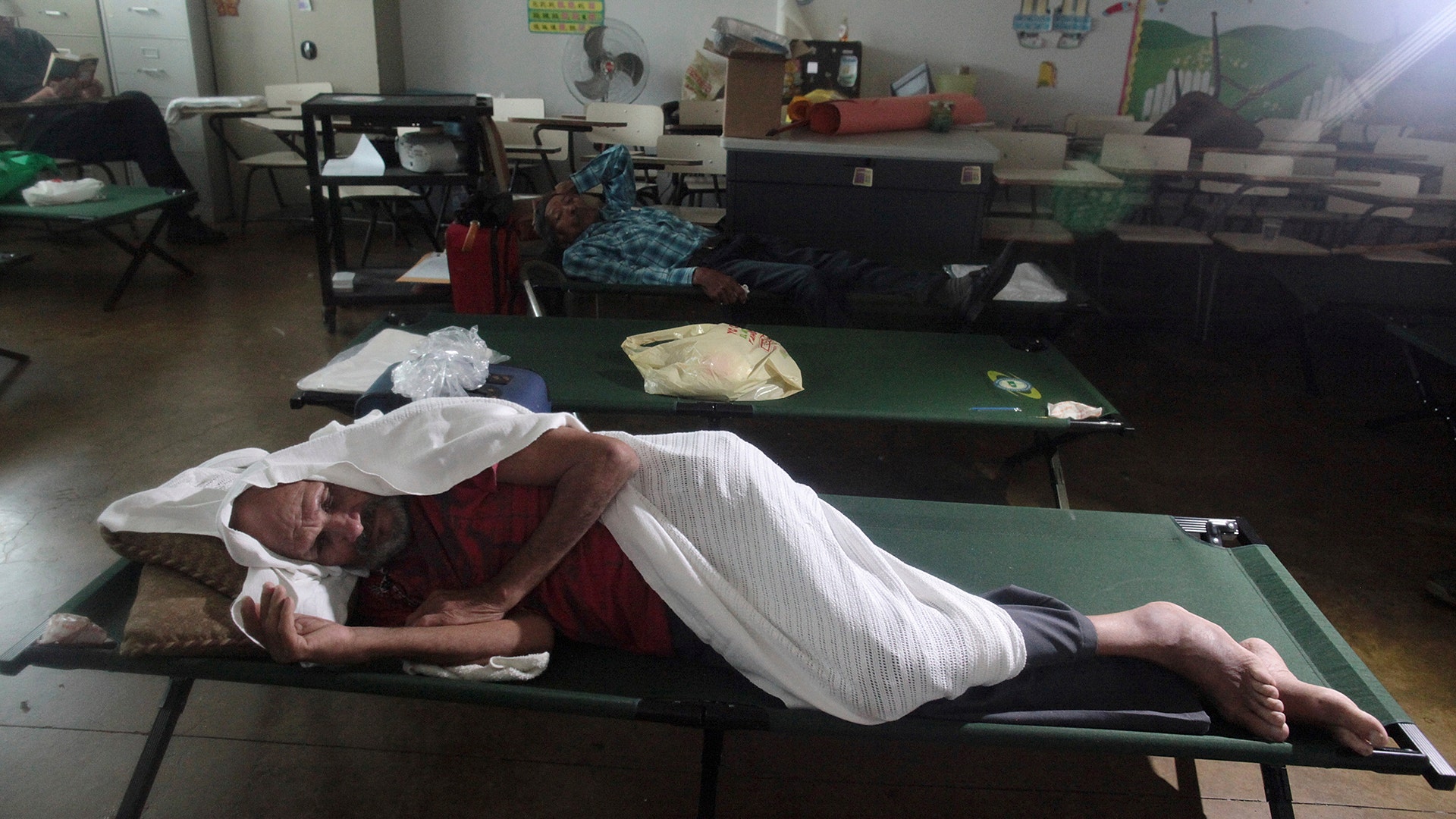 People shelter in a school as Hurricane Irma slammed across islands in the northern Caribbean on Wednesday, in Fajardo, Puerto Rico