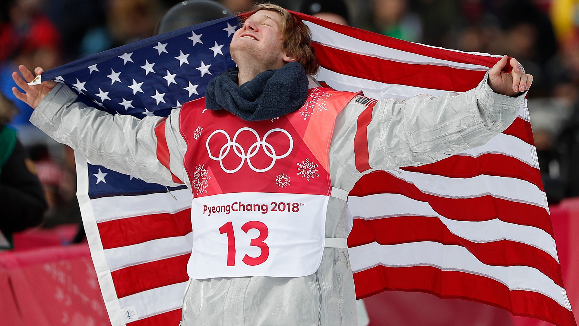 Kyle Mack of the USA celebrates with his national flag