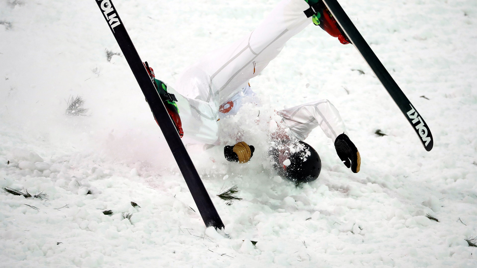 Lewis Irving of Canada falls during the qualifications of the Freestyle Skiing