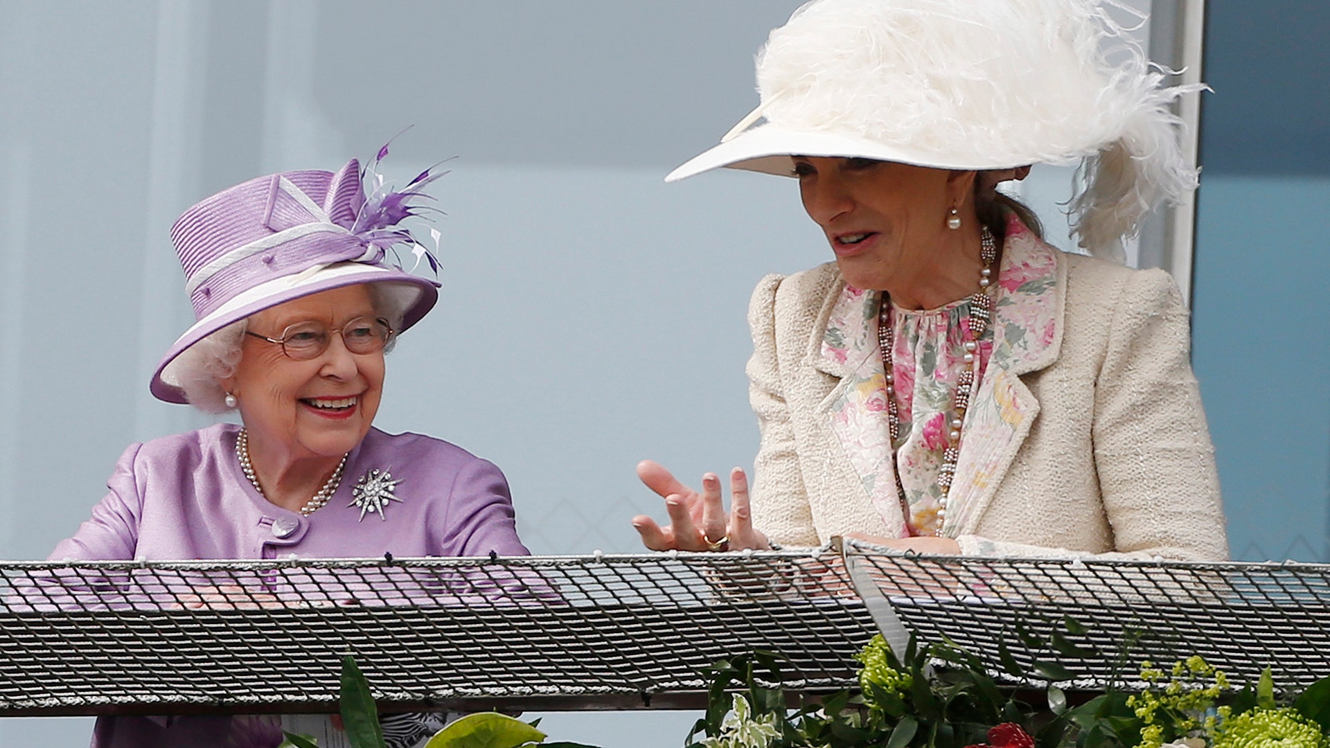 Britain's Queen Elizabeth and Britain's Princess Michael of Kent talk at the Epsom Derby Festival in Epsom, England, June 7, 2014