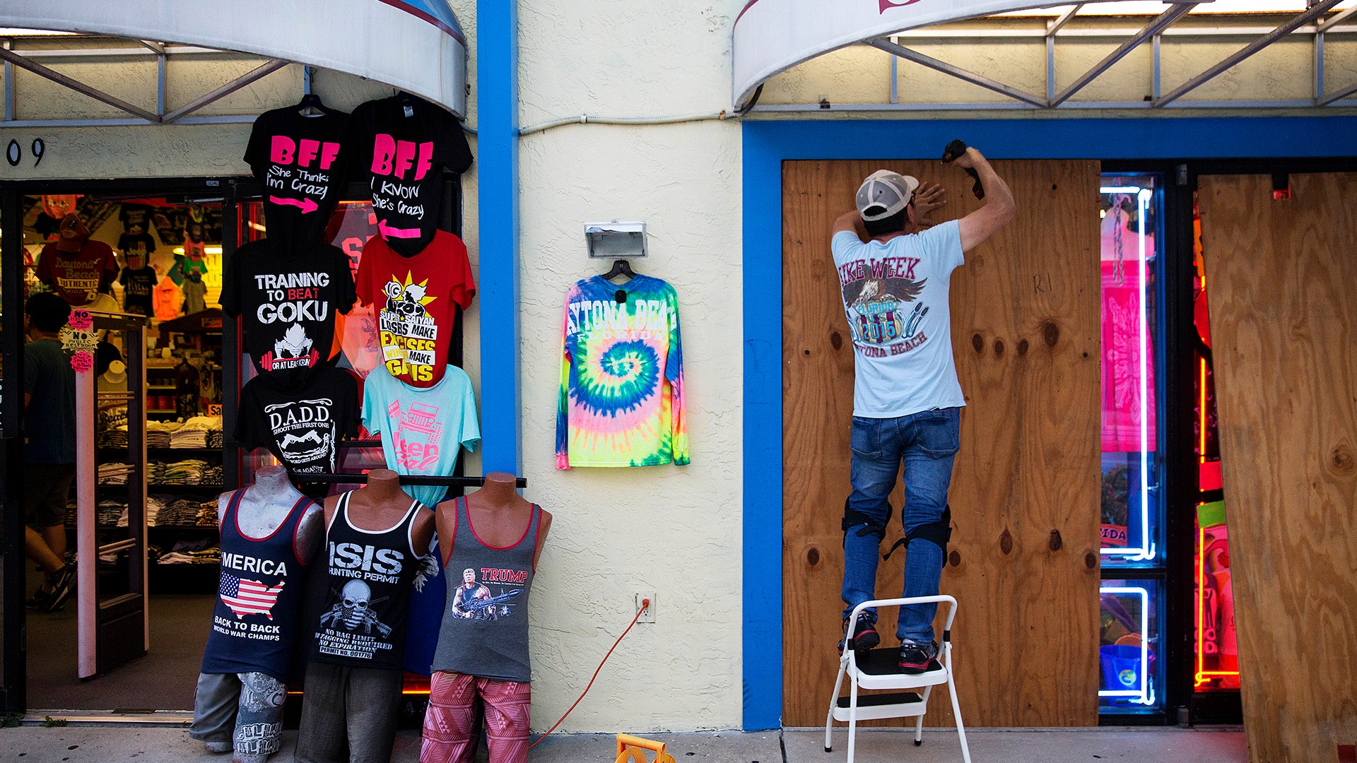 Jone Yoon boards up his beach souvenir shop ahead of Hurricane Irma in Daytona Beach, Fla., Thursday