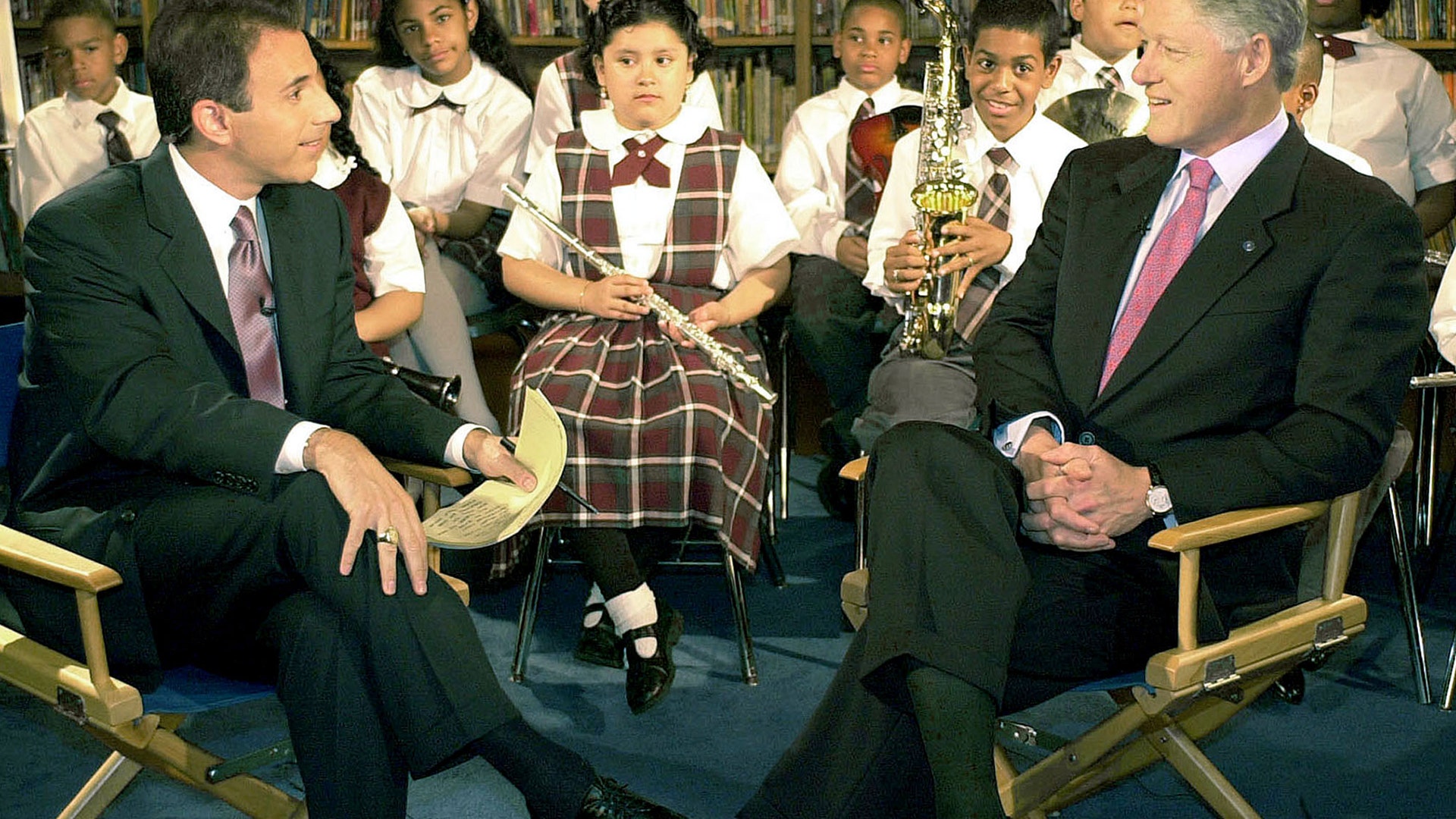 President Bill Clinton chats with NBC-TV host Matt Lauer at the Joseph Lanzetta School in East Harlem, NY, June 16, 2000