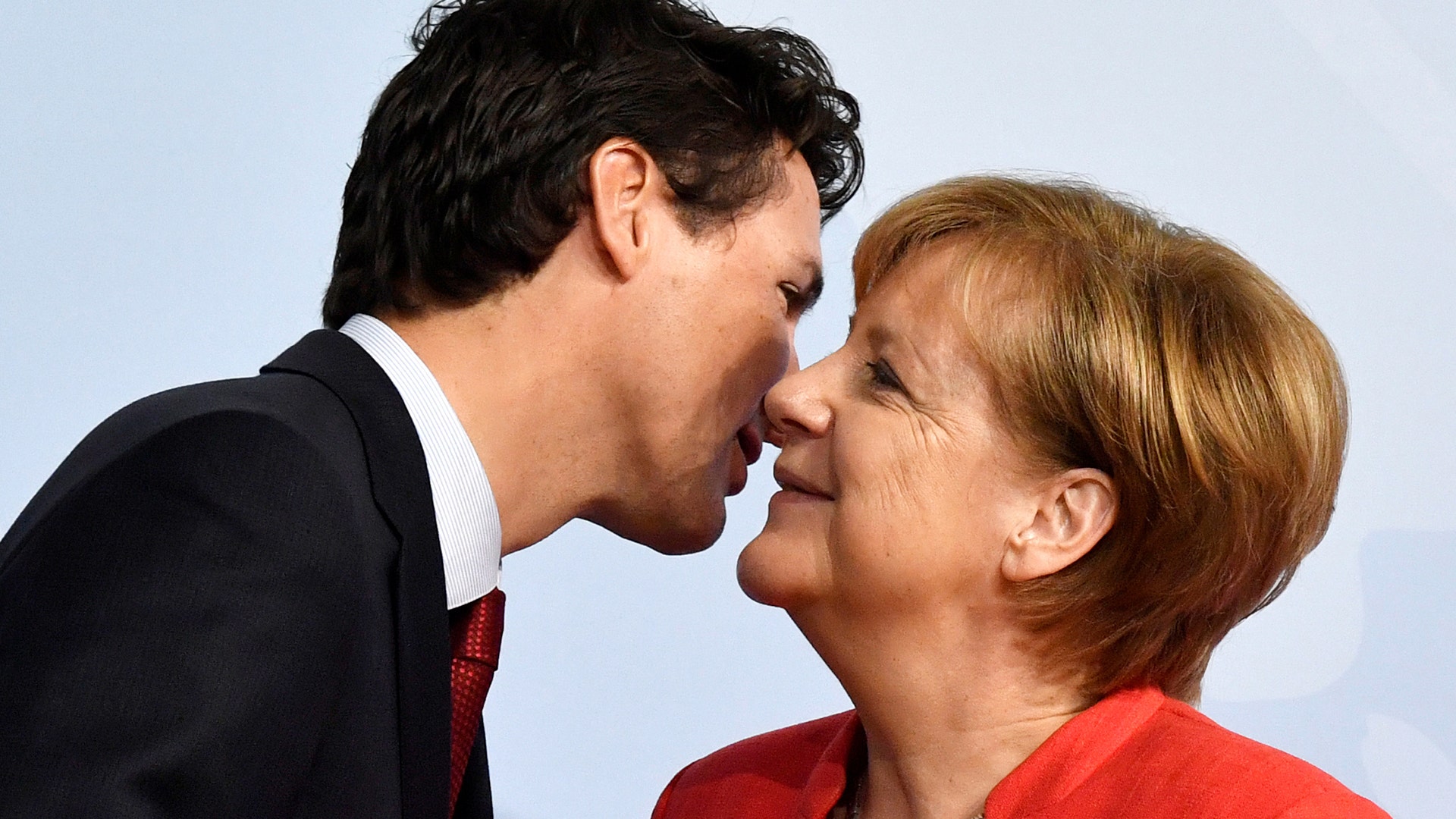 German Chancellor Angela Merkel greets Canada's Prime Minister Justin Trudeau at the beginning of the G-20 summit in Hamburg, Germany