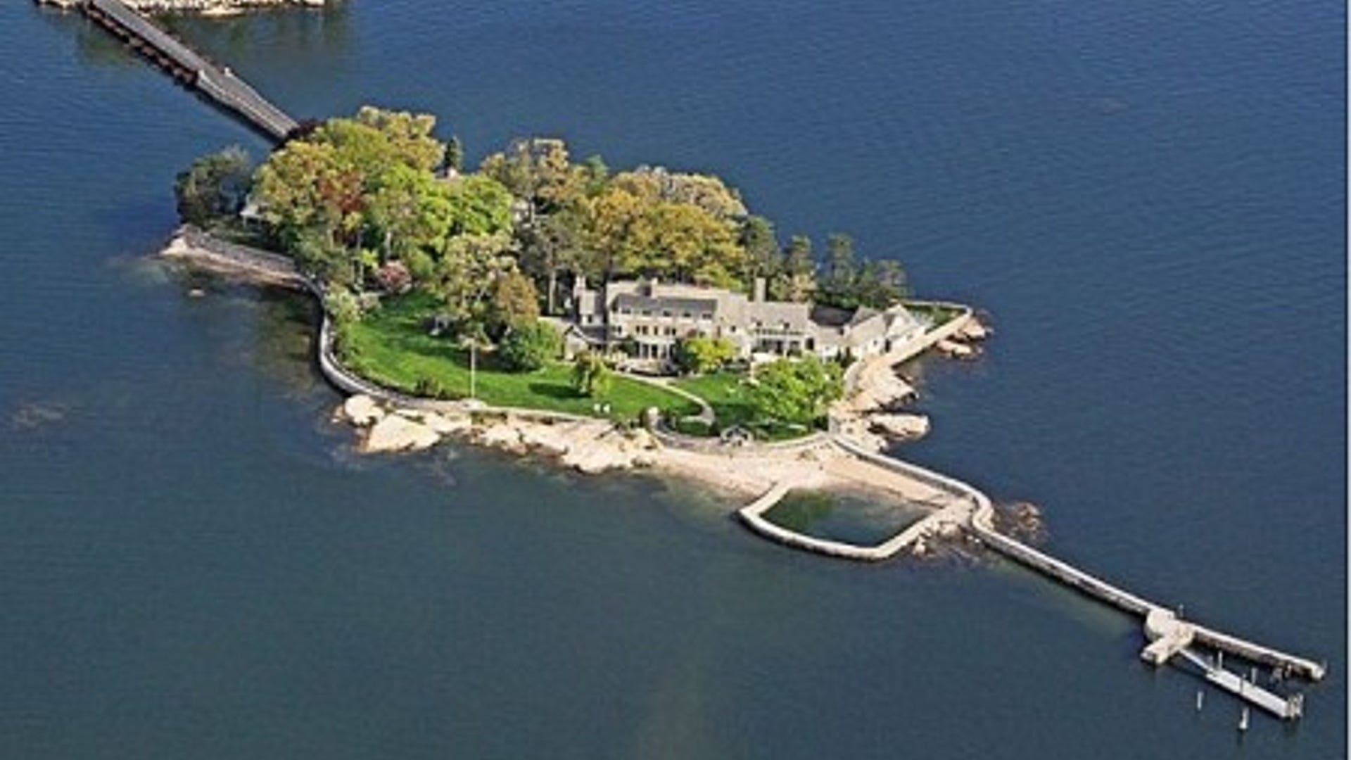 140 Wallacks Dr Stamford, CT. For Sale: $18,900,000. Forget the freeway commute to Manhattan; how about a boat ride from a private island in Long Island Sound? Built in 1909, the 14,000+-square-foot home sits on a 3.5-acre island; and includes a guest cottage, staff quarters and working greenhouse. Explore the private piece of Stamford real estate with terraces, gardens and stone seawalls throughout the property. Just like its mainland counterpart, living on a private island near New York is pricey; even with low mortgage rates, this home has an estimated monthly payment of nearly a $100,000.
